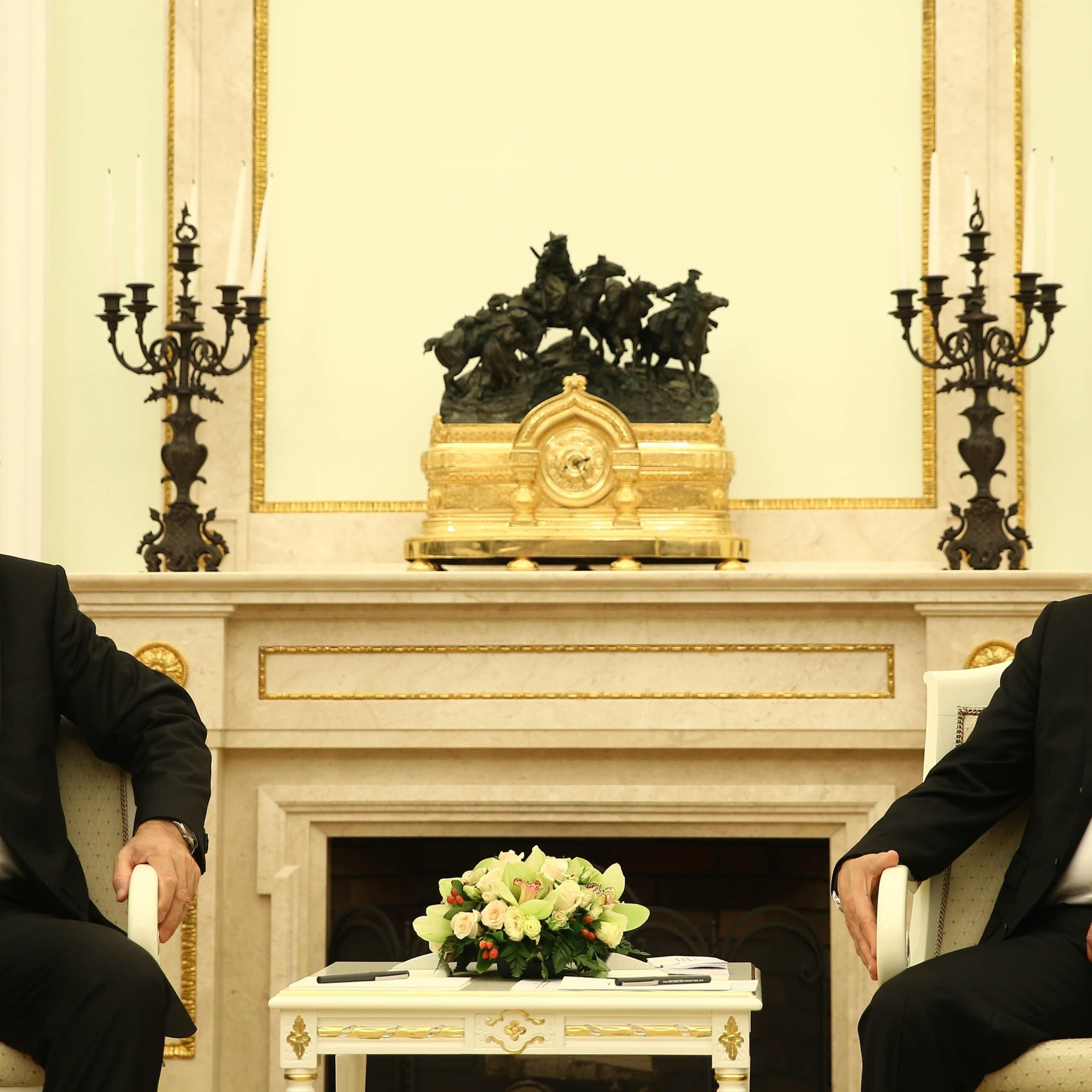 Turkey's President Recep Tayyip Erdogan (L) meets Russian President Vladimir Putin (R) after attending the opening ceremony of the Moscow Central Mosque in Moscow on Sept. 23, 2015.