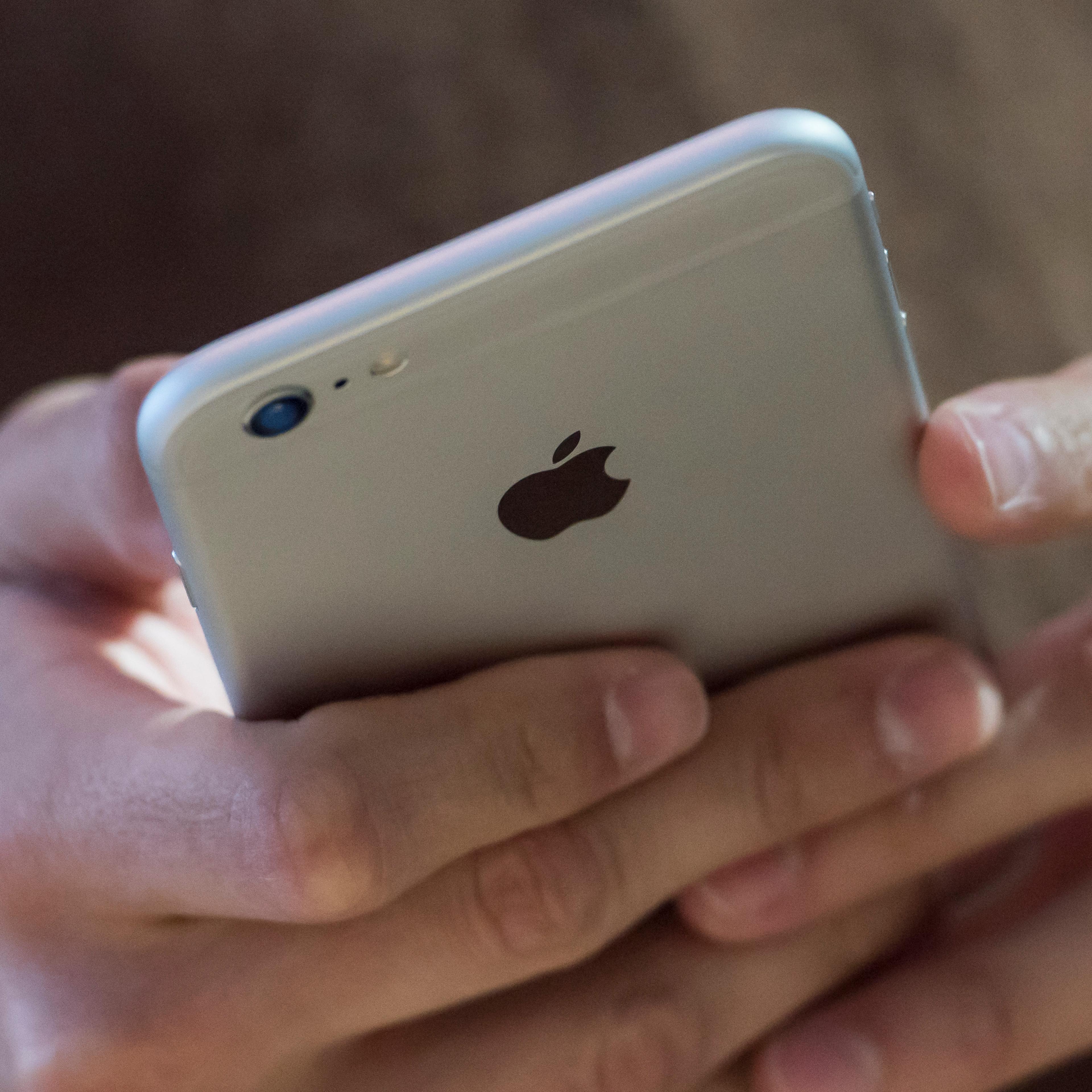 A customer looks at an iPhone 6s Plus in Palo Alto, Calif.