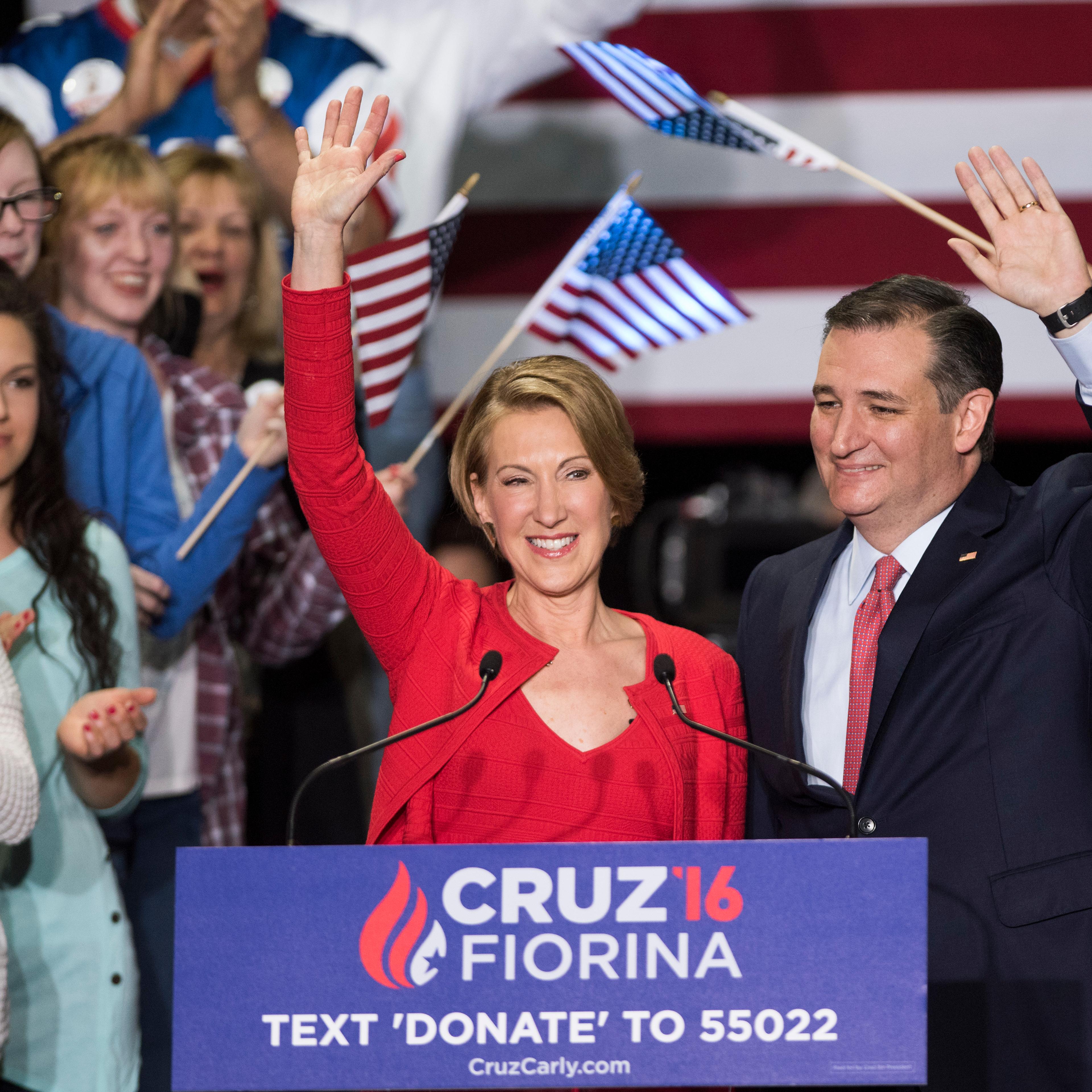 Republican presidential candidate Sen. Ted Cruz (R-TX) (R) greets supporters with former Hewlett-Packard chief executive Carly Fiorina at a campaign rally in the Pavilion at the Pan Am Plaza in Indianapolis on April 27, 2016.