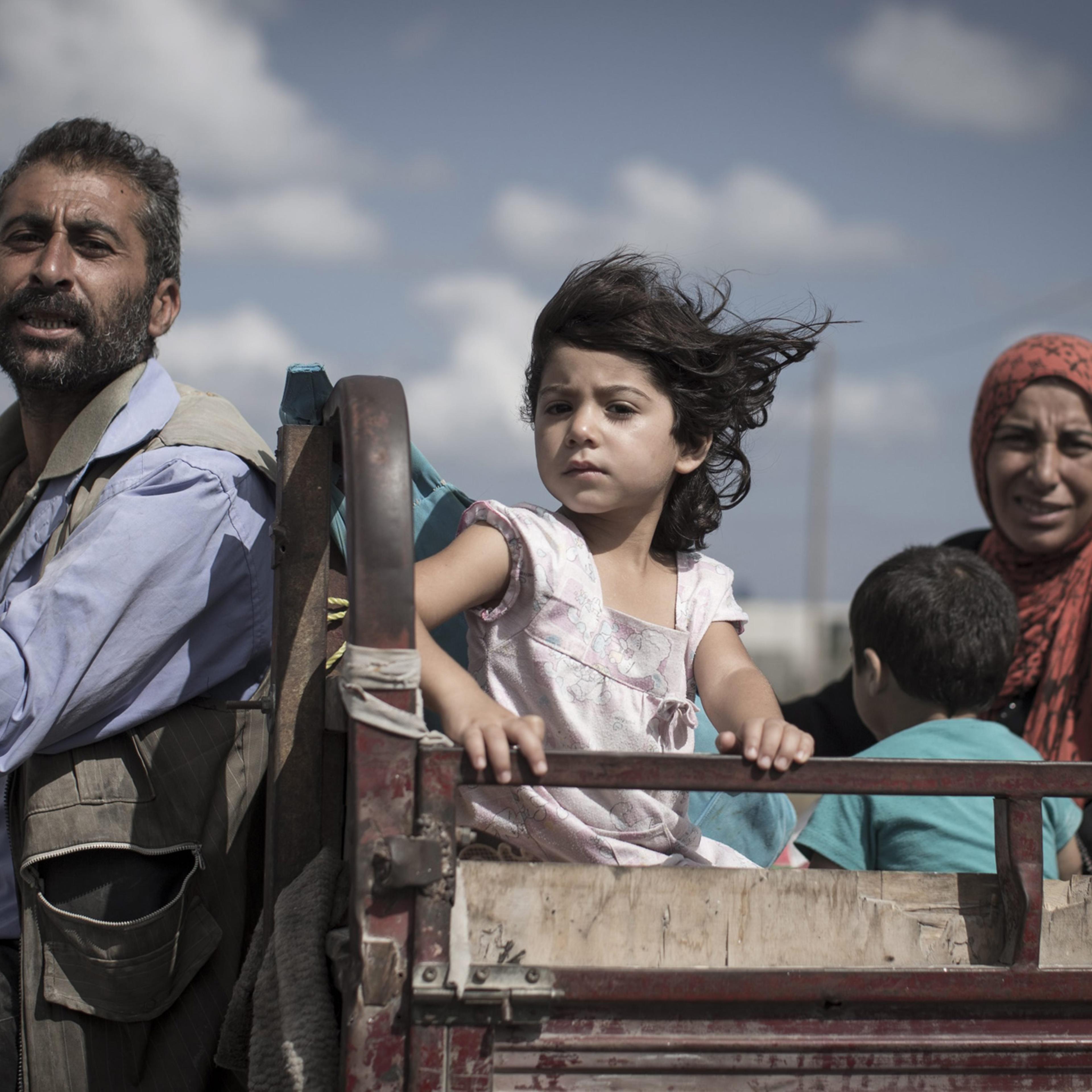 A Palestinian family who fled their homes is en route to seek shelter in a UN school in Khan Younis, central Gaza Strip, 18 July 18, 2014.