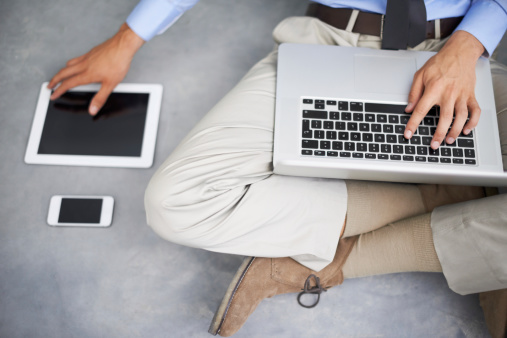 man-using-laptop-tablet-smartphone