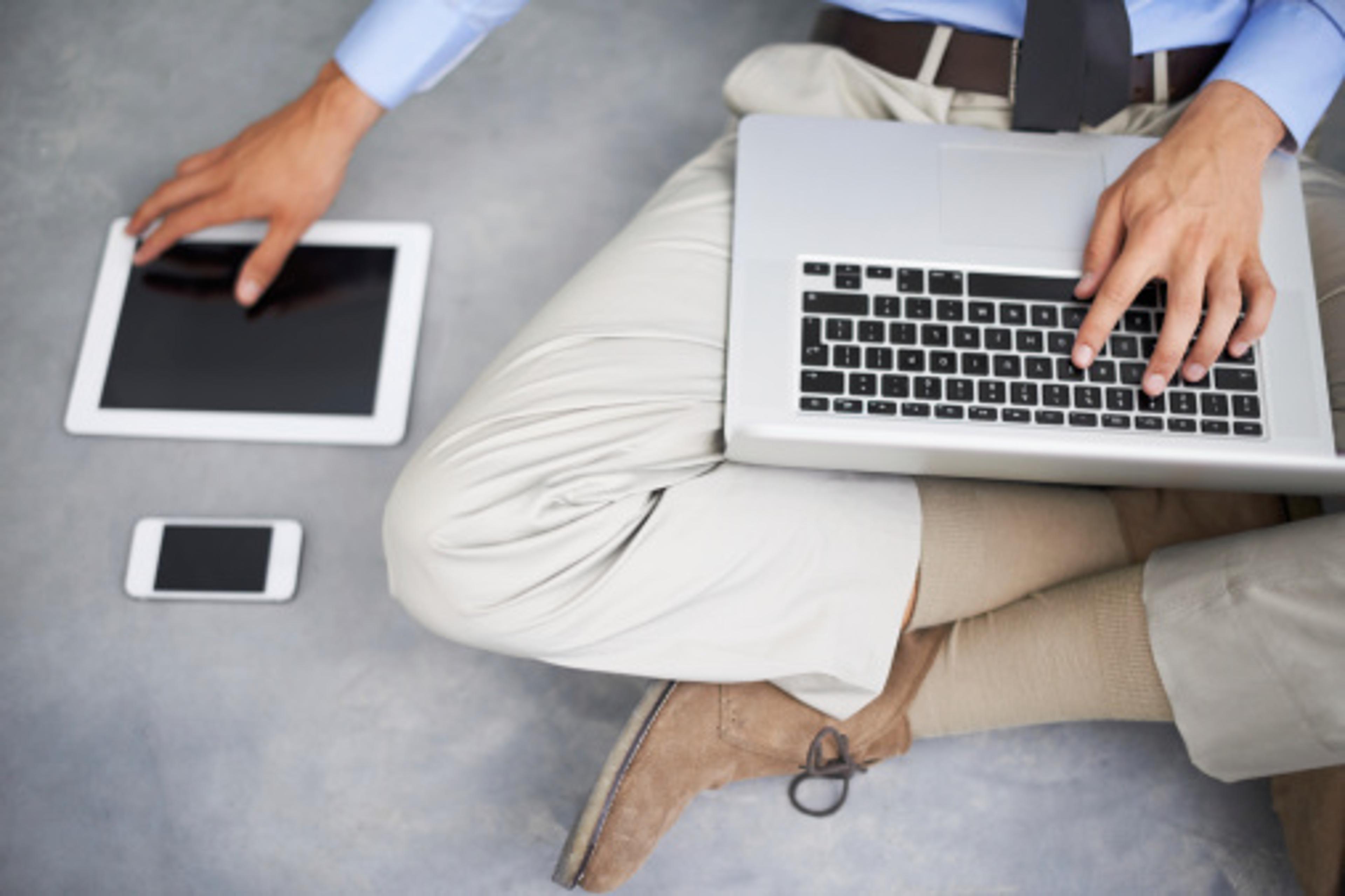 man-using-laptop-tablet-smartphone
