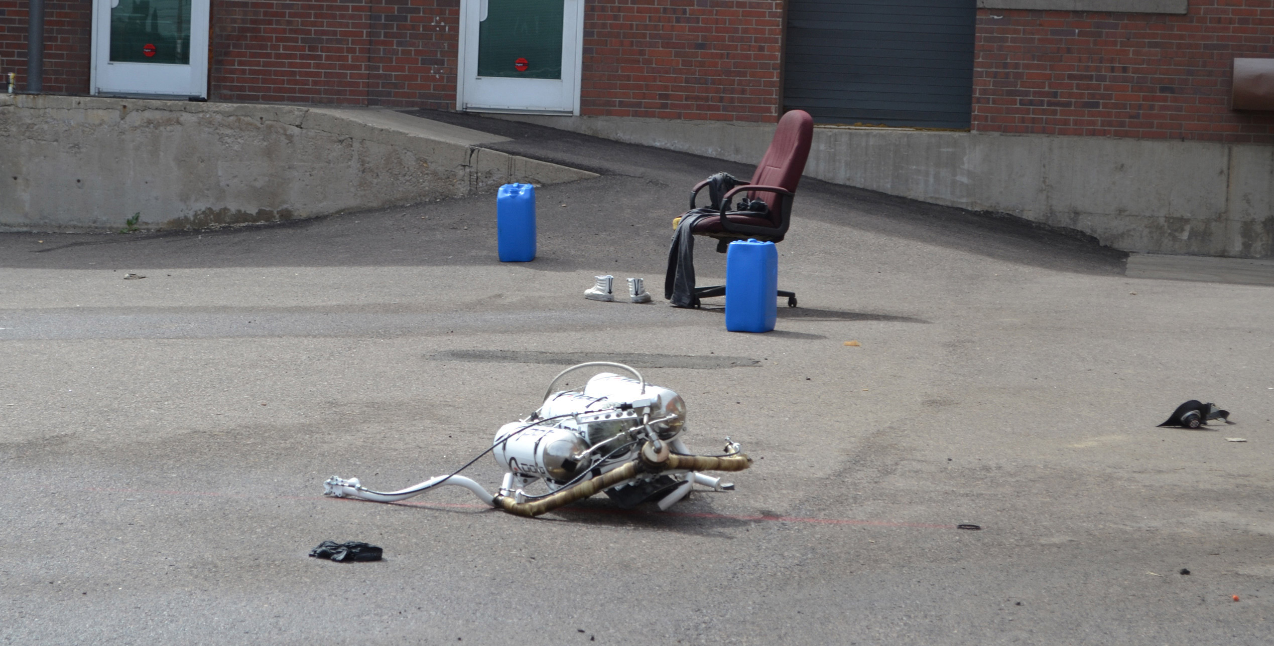 A jetpack lays at the site of a crash Friday, April 8, 2016, in Denver. The man who was wearing the pack, which was being demonstrated at a private business in the Mile High City, is in stable condition after the accident. (AP Photo/P. Solomon Banda)