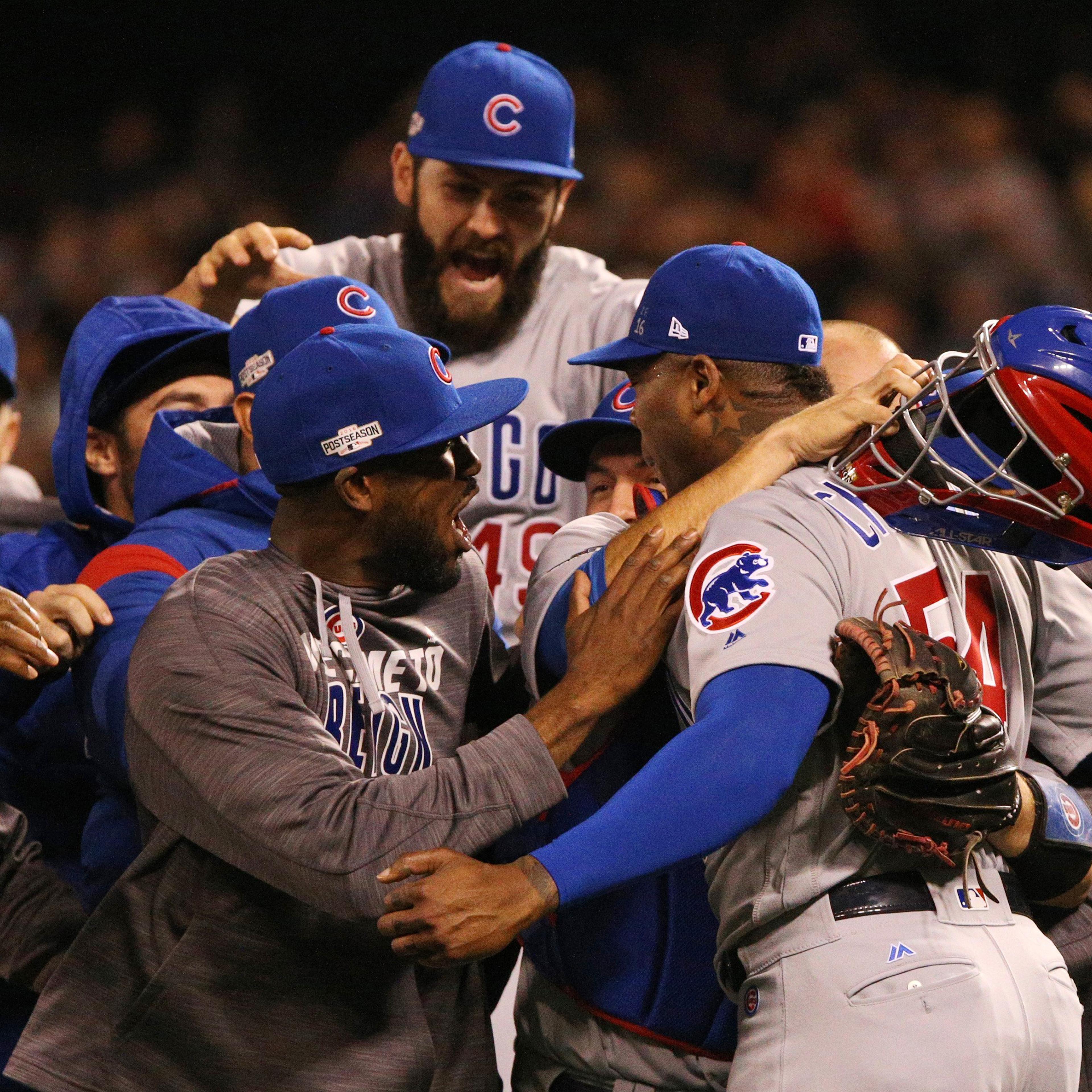 The Chicago Cubs celebrate a 6-5 series-clinching win against the San Francisco Giants in Game 4 of the National League Division Series in San Francisco, on Tuesday, Oct. 11, 2016.