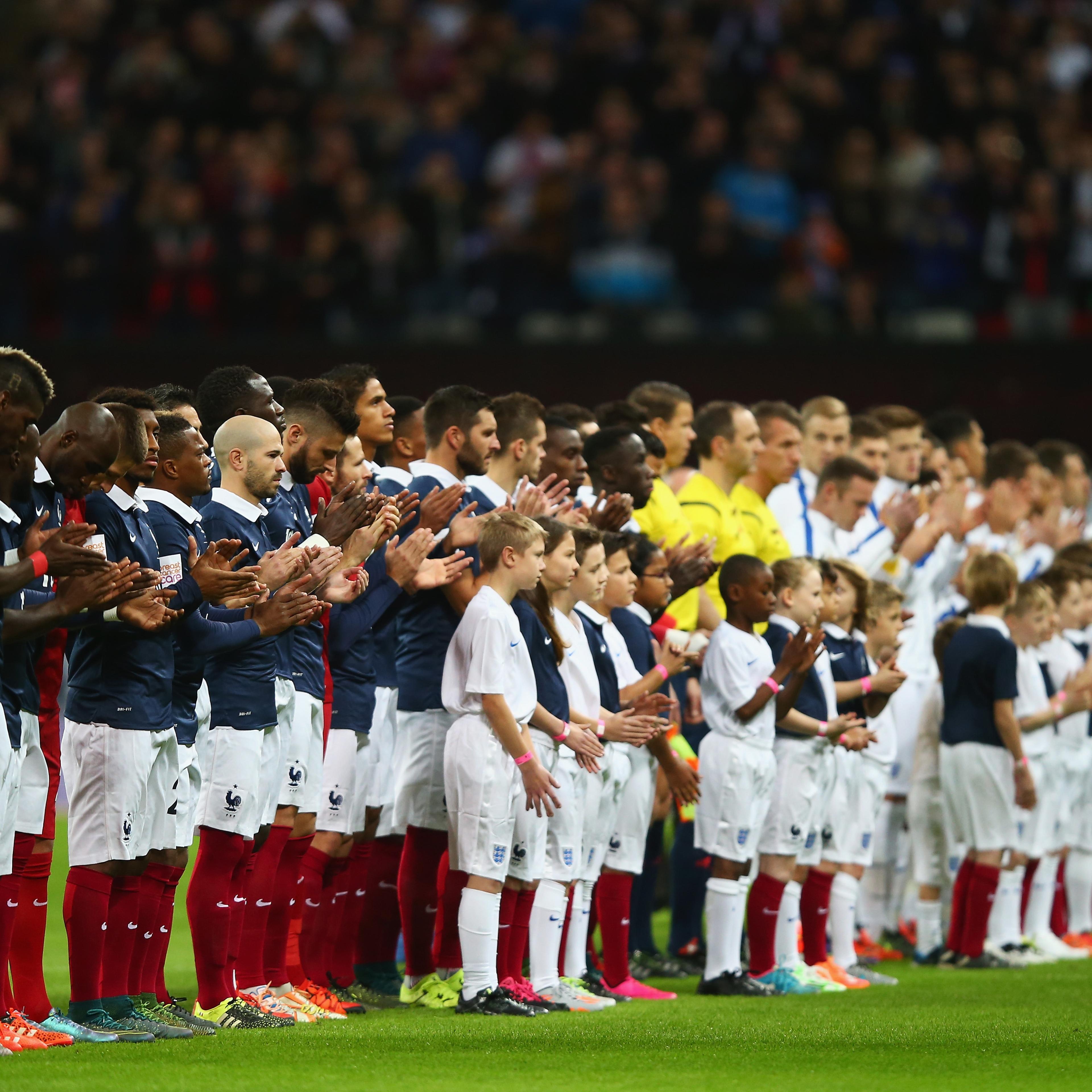 Players line up for the national anthems prior to the International Friendly match between England and France at Wembley Stadium on Nov. 17, 2015 in London.