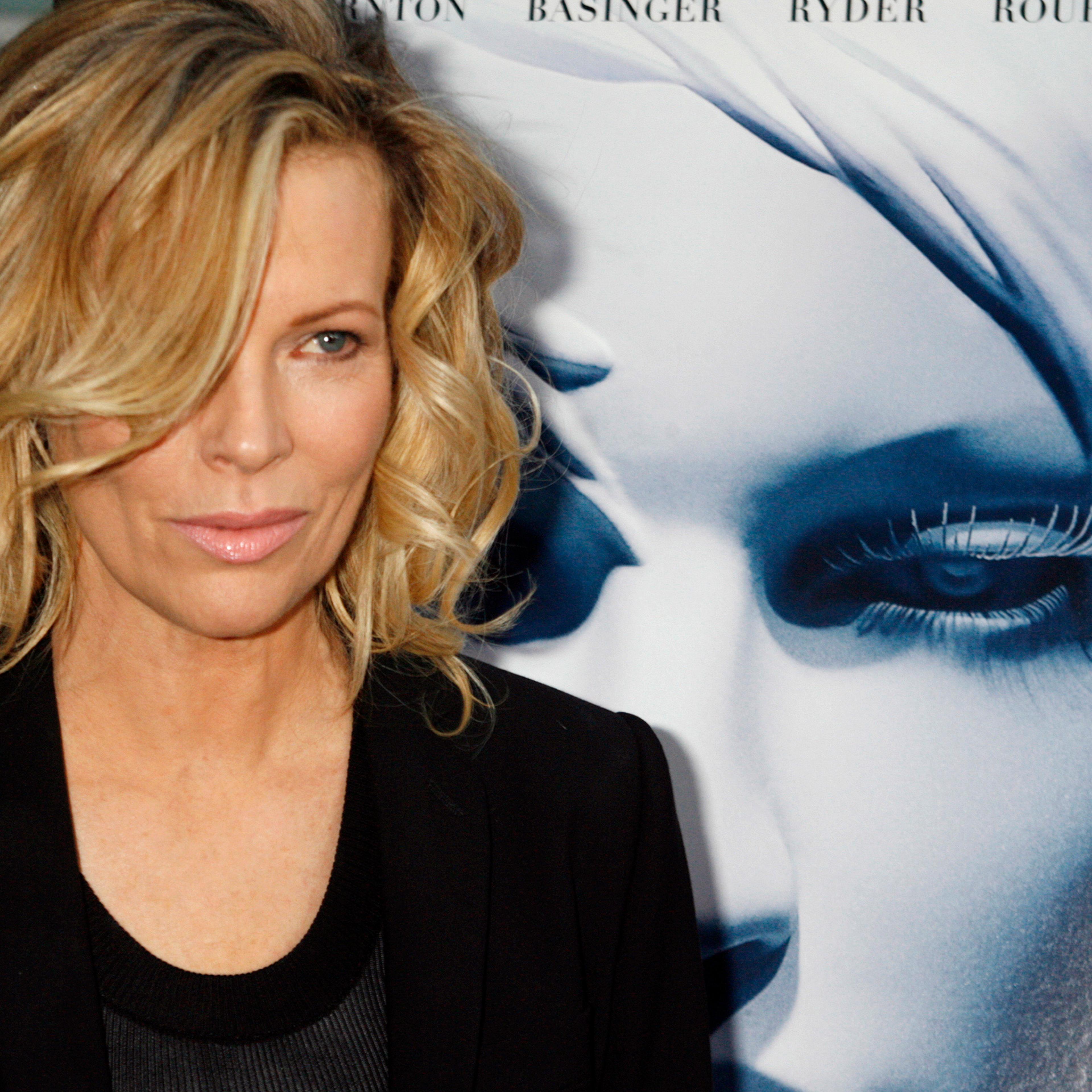 Actress Kim Basinger, star of the film "The Informers", poses at the film's premiere in Hollywood
