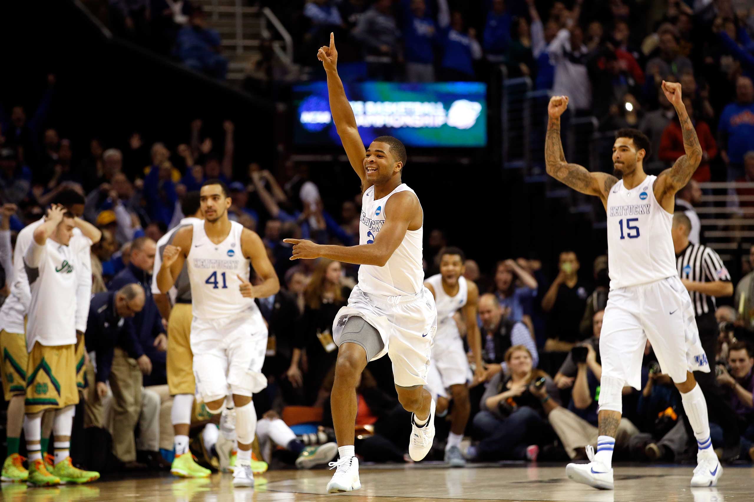 Aaron Harrison of the Kentucky Wildcats celebrates after defeating the Notre Dame Fighting Irish during the Midwest Regional Final of the 2015 NCAA Men's Basketball tournament at Quicken Loans Arena in Cleveland, on Mar. 28, 2015.