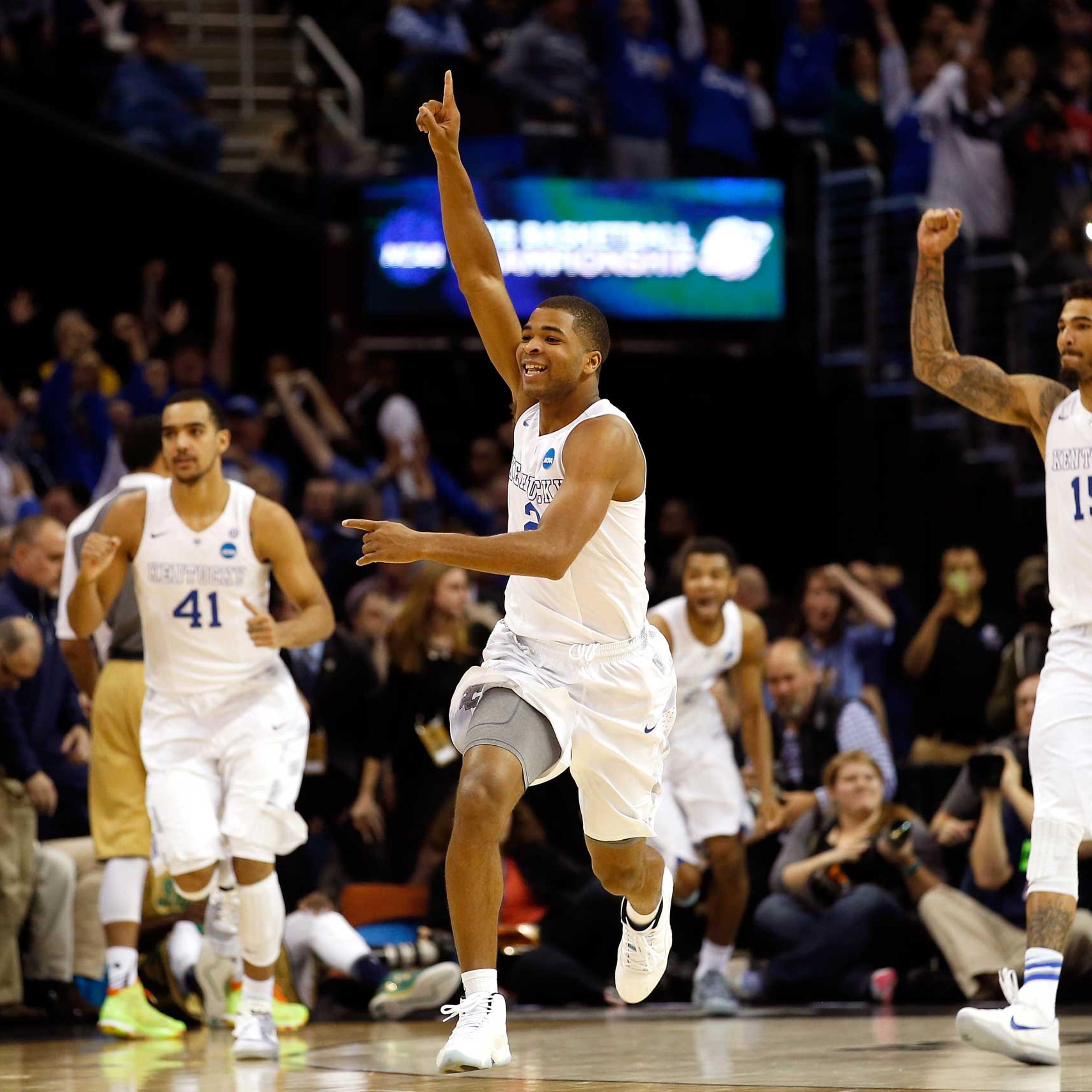 Aaron Harrison of the Kentucky Wildcats celebrates after defeating the Notre Dame Fighting Irish during the Midwest Regional Final of the 2015 NCAA Men's Basketball tournament at Quicken Loans Arena in Cleveland, on Mar. 28, 2015.