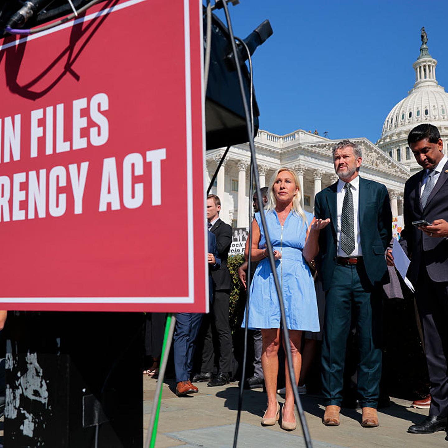 U.S. Reps. Marjorie Taylor Greene (R, Ga.), Rep. Thomas Massie (R, Ky.) and Rep. Ro Khanna (D, Calif.) look on during a news conference with alleged victims of disgraced financier and sex trafficker Jeffrey Epstein outside the U.S. Capitol in Washington,