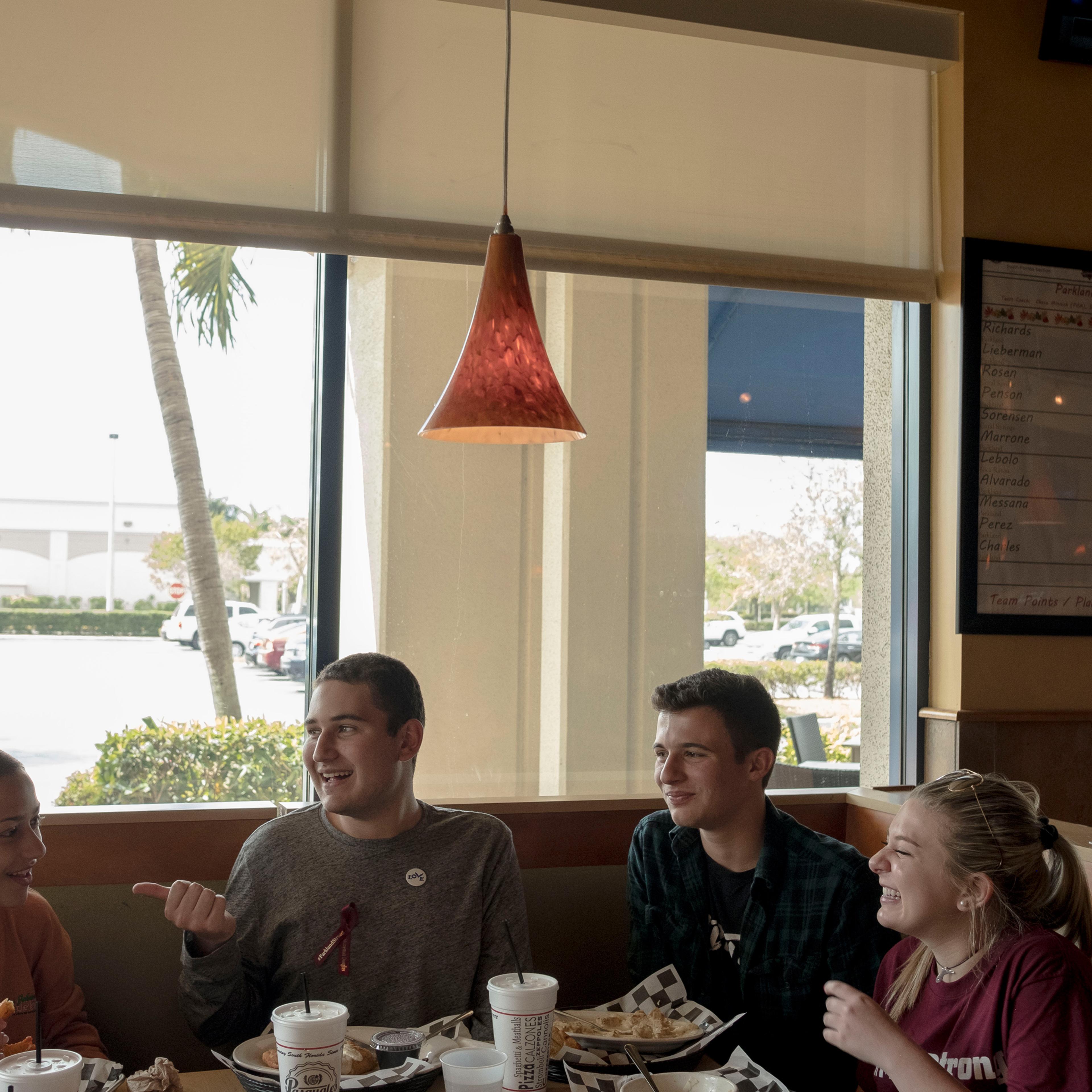 Emma González, Alex Wind, Cameron Kasky and Jaclyn Corin dine at Pasquales in Coral Springs near Parkland on March 6.