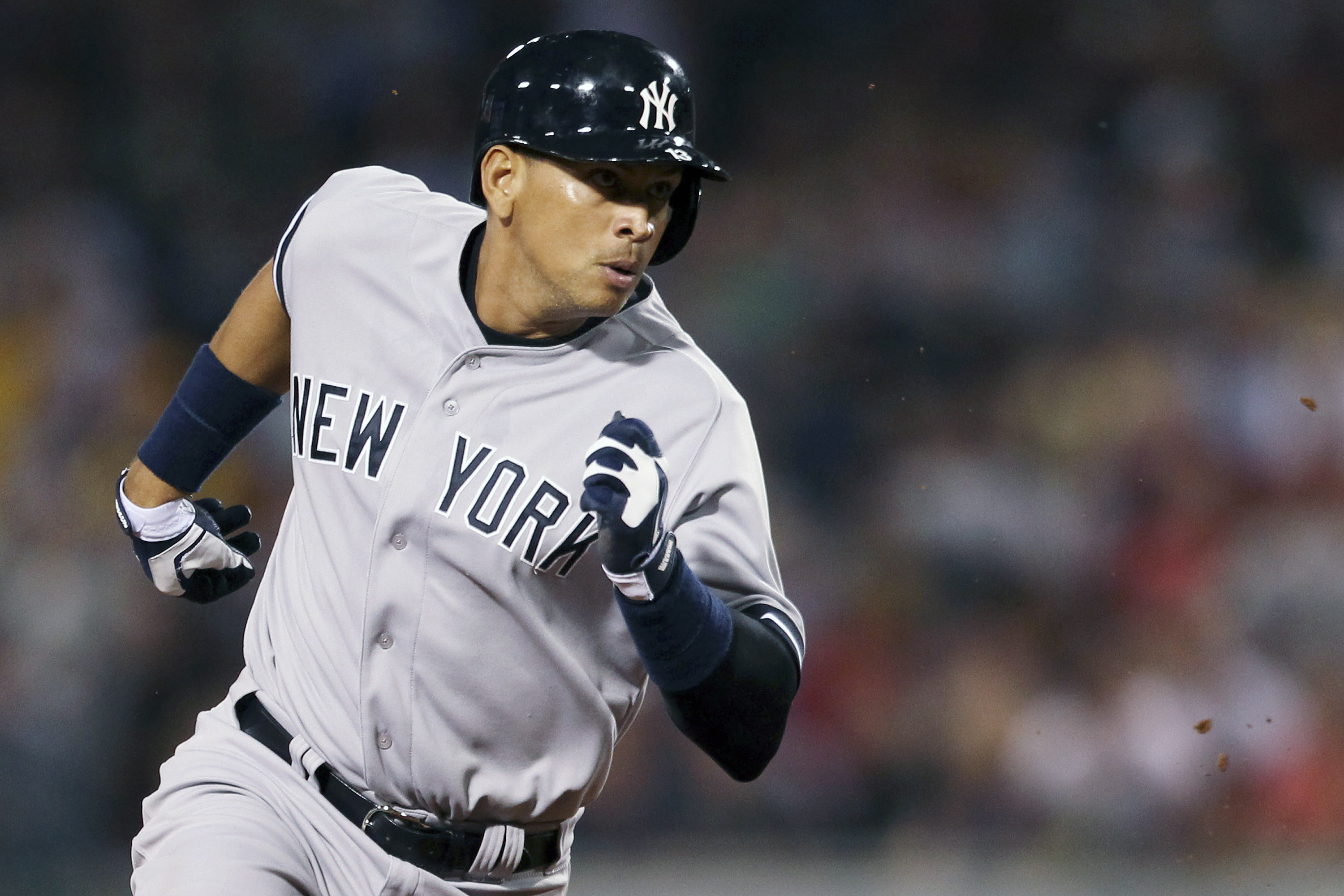 New York Yankees' Alex Rodriguez runs to third base in their MLB American League baseball game against the Boston Red Sox in Boston, Massachusetts, August 18, 2013