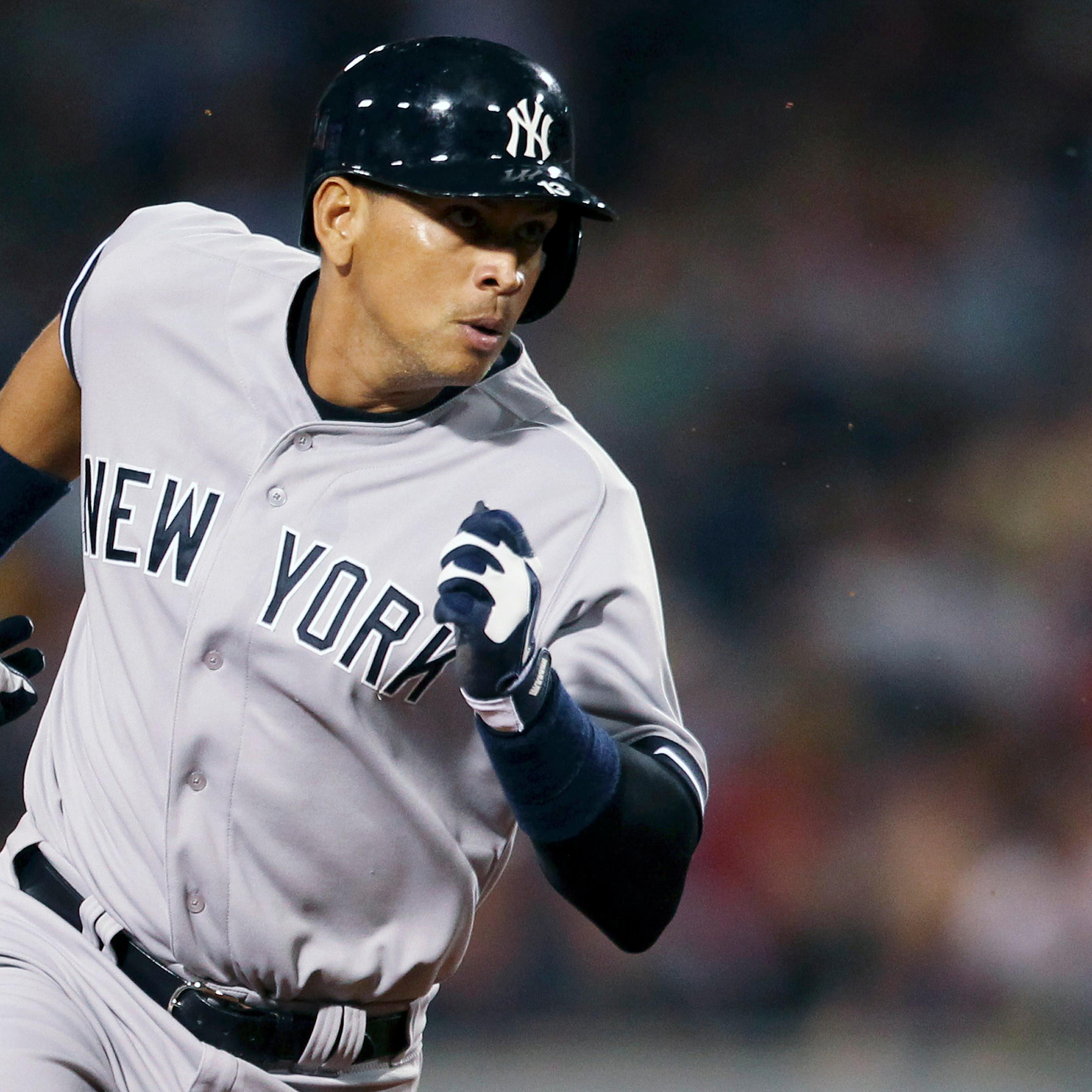 New York Yankees' Alex Rodriguez runs to third base in their MLB American League baseball game against the Boston Red Sox in Boston, Massachusetts, August 18, 2013