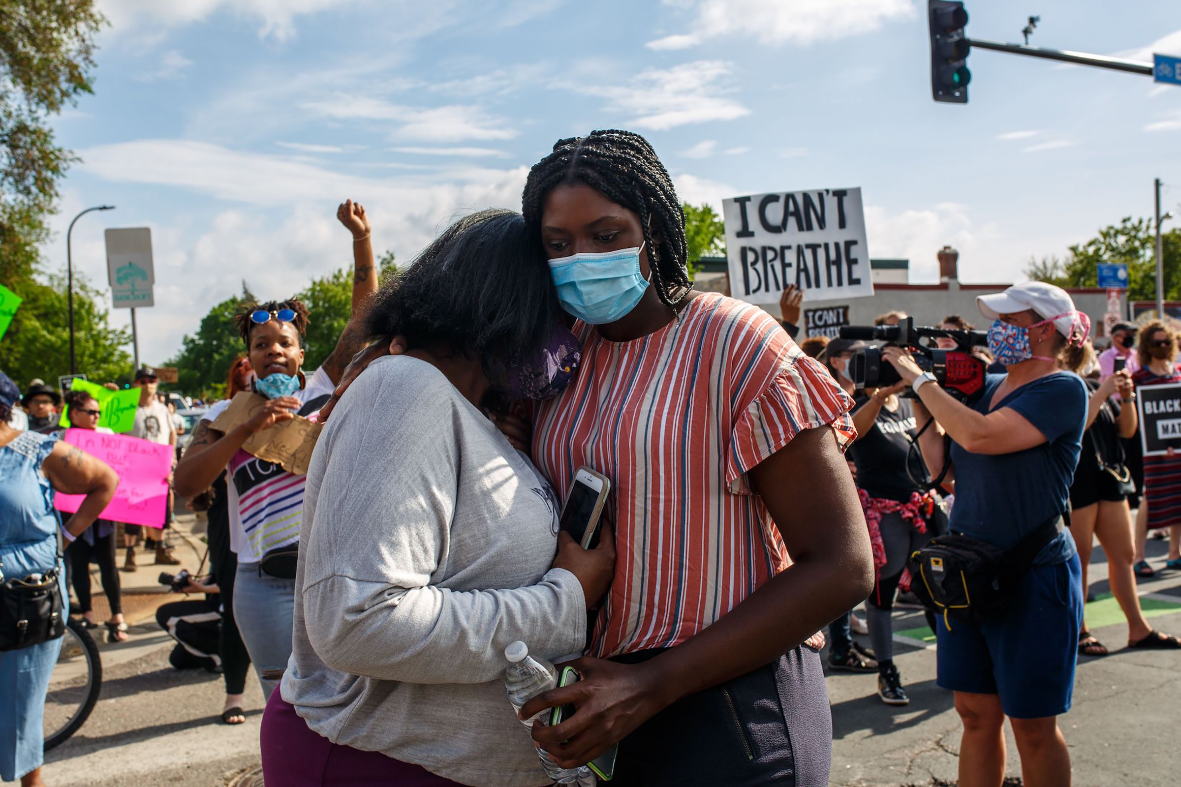 Two women embrace at a protest over the killing of George Floyd in Minneapolis on May 26, 2020.