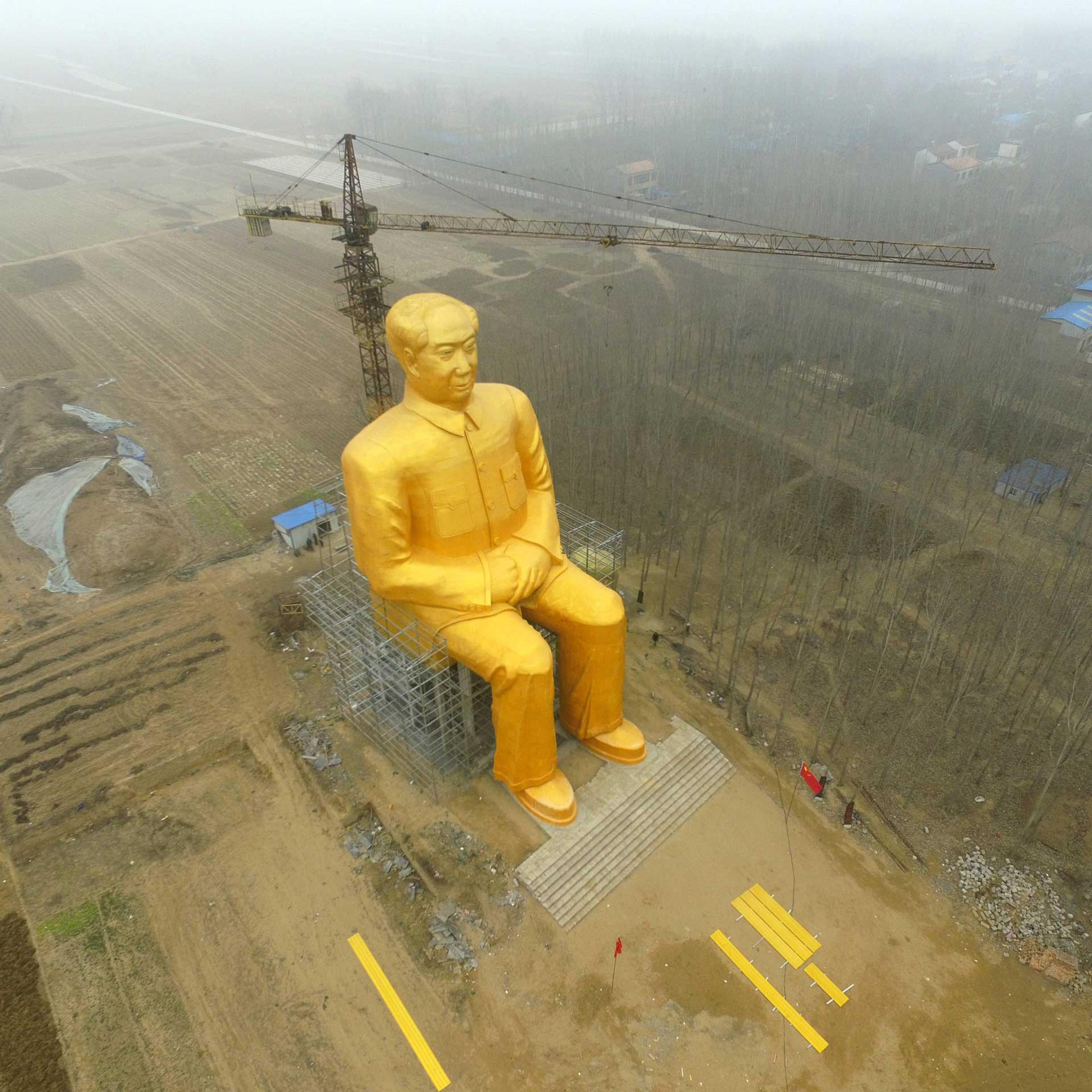 A huge statue of Chairman Mao Zedong, 36.6 meters in height, is seen under construction at Zhushigang village in Tongxu County, China, on Jan. 4.