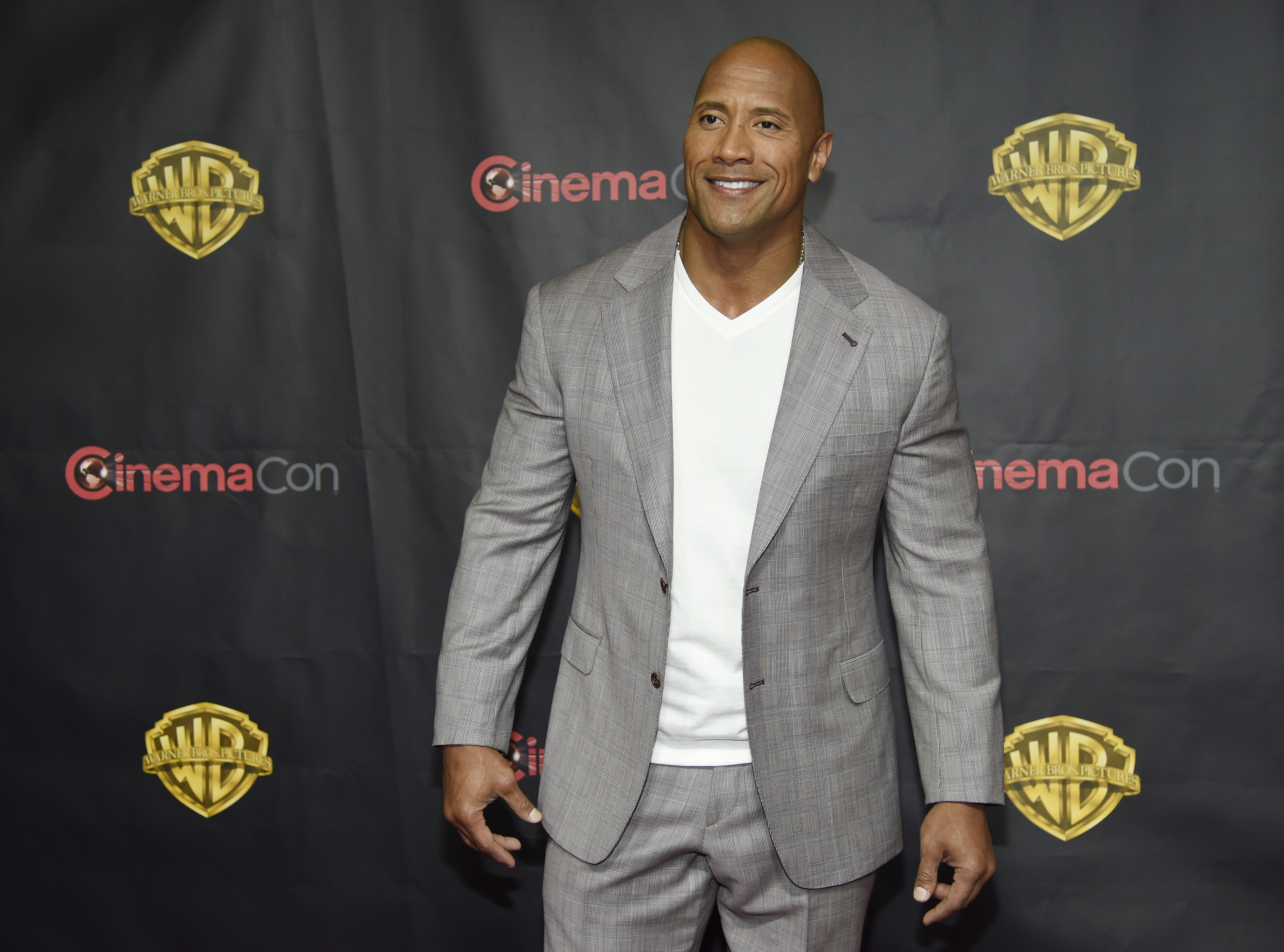 Dwayne Johnson, a cast member in the upcoming film "San Andreas," poses before the Warner Bros. presentation at CinemaCon 2015 at Caesars Palace on Tuesday, April 21, 2015, in Las Vegas