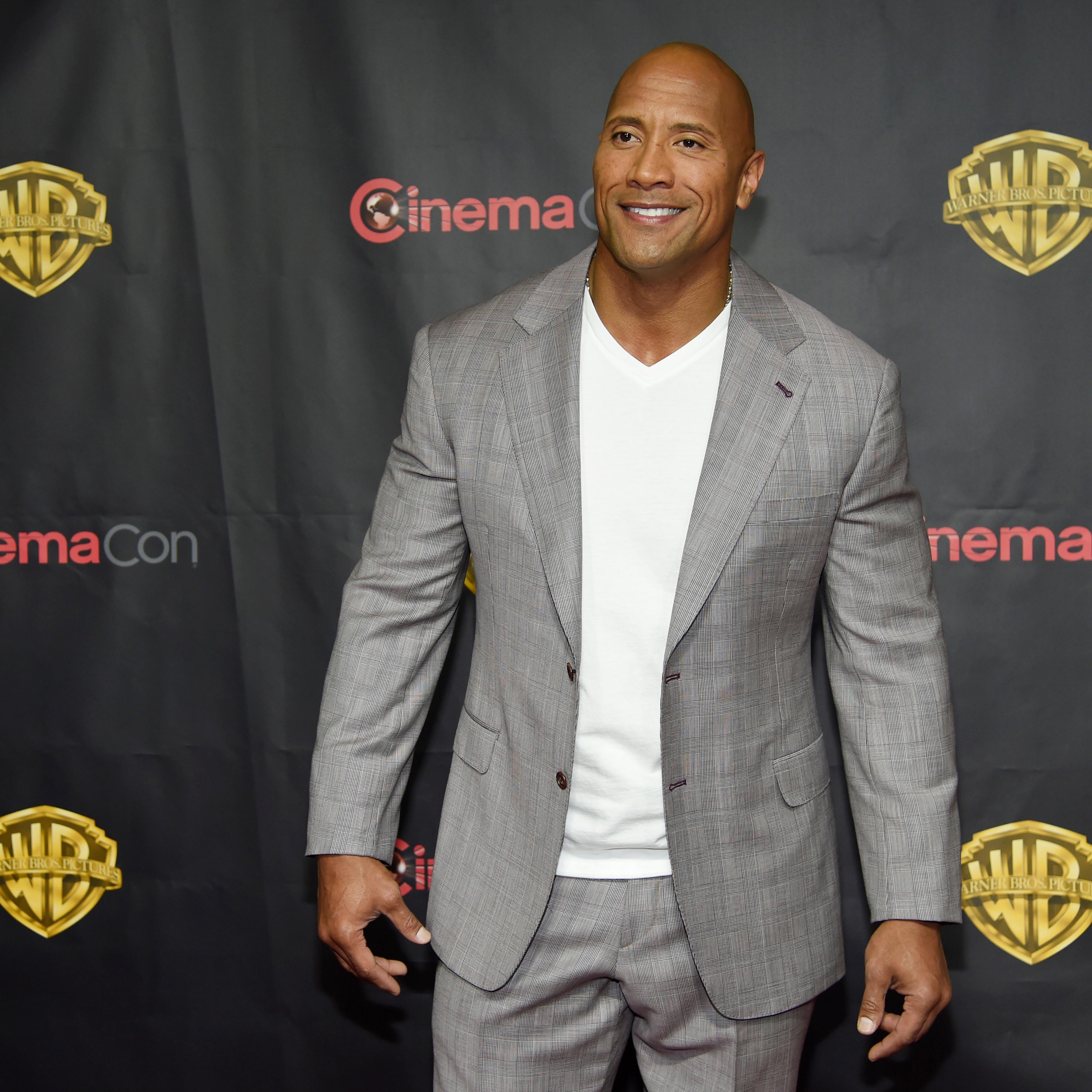 Dwayne Johnson, a cast member in the upcoming film "San Andreas," poses before the Warner Bros. presentation at CinemaCon 2015 at Caesars Palace on Tuesday, April 21, 2015, in Las Vegas