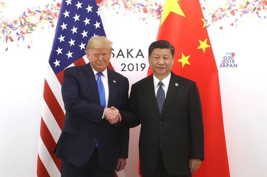 Xi Jinping and Donald Trump shake hands as Osaka hosts the G20 Summit