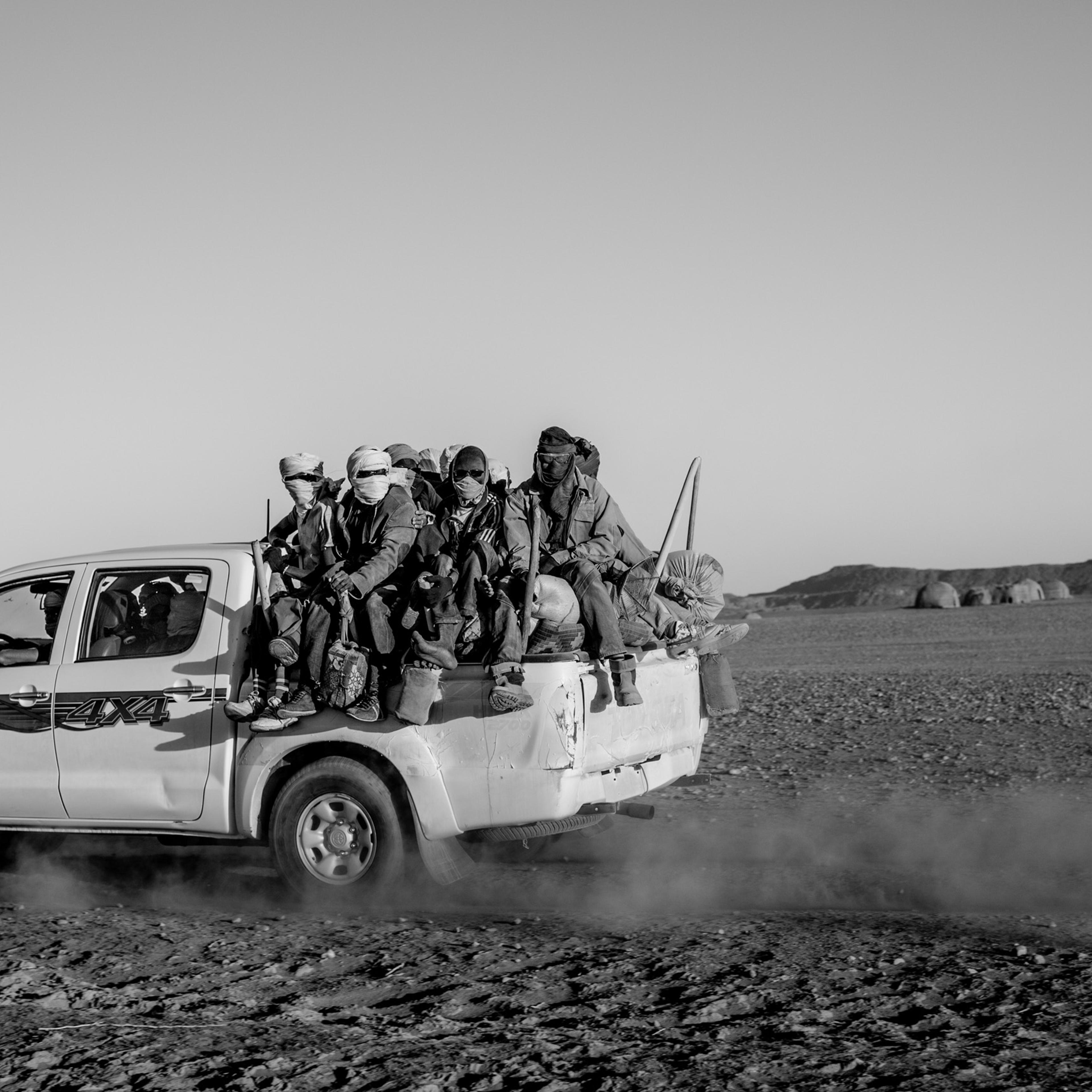 Migrants are stuffed into the back of a pickup truck as they begin the first day of their five day journey across the Sahara to Libya, in Niger on April 20, 2015.
