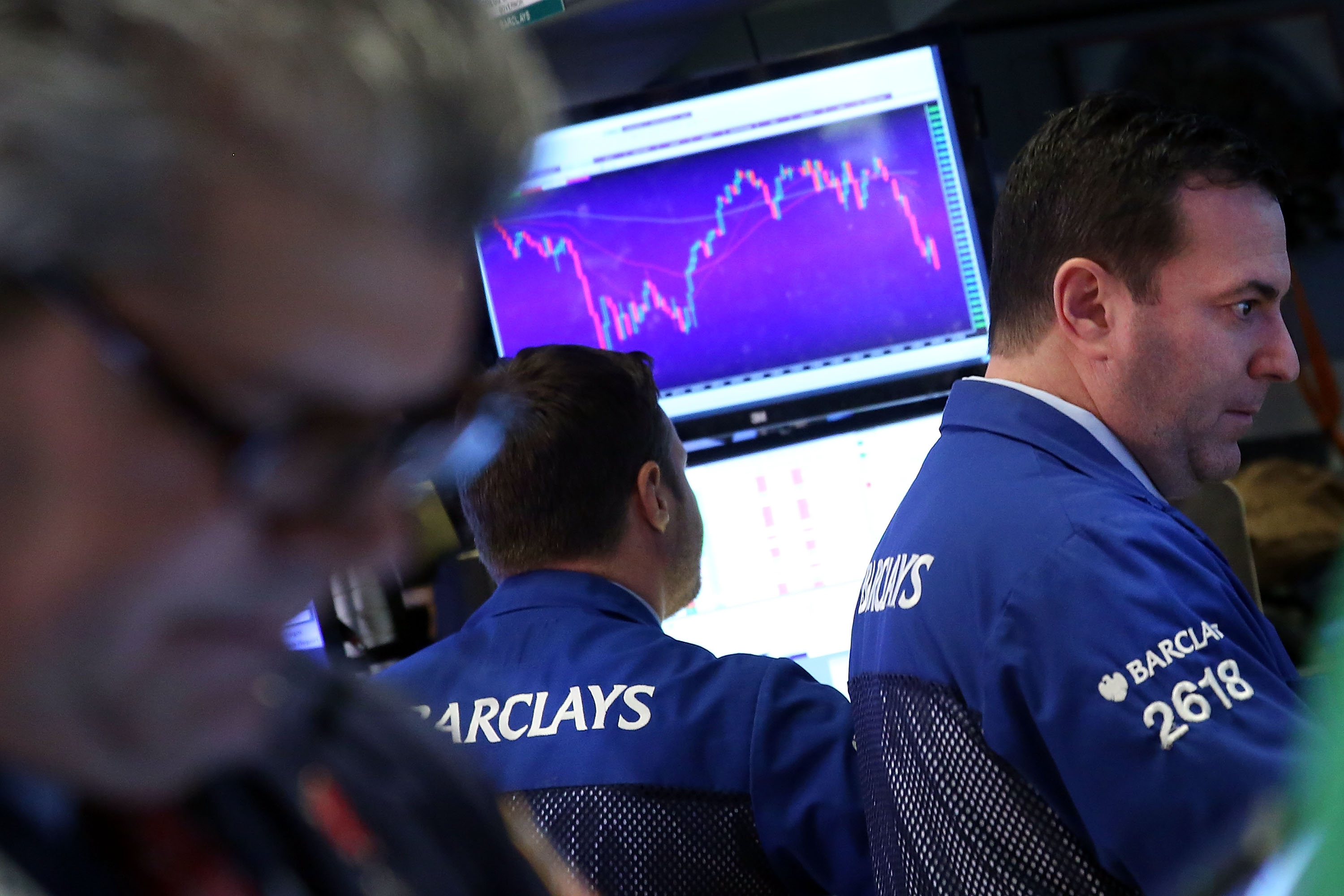 Traders work on the floor of the New York Stock Exchange (NYSE) on January 13, 2016 in New York City.