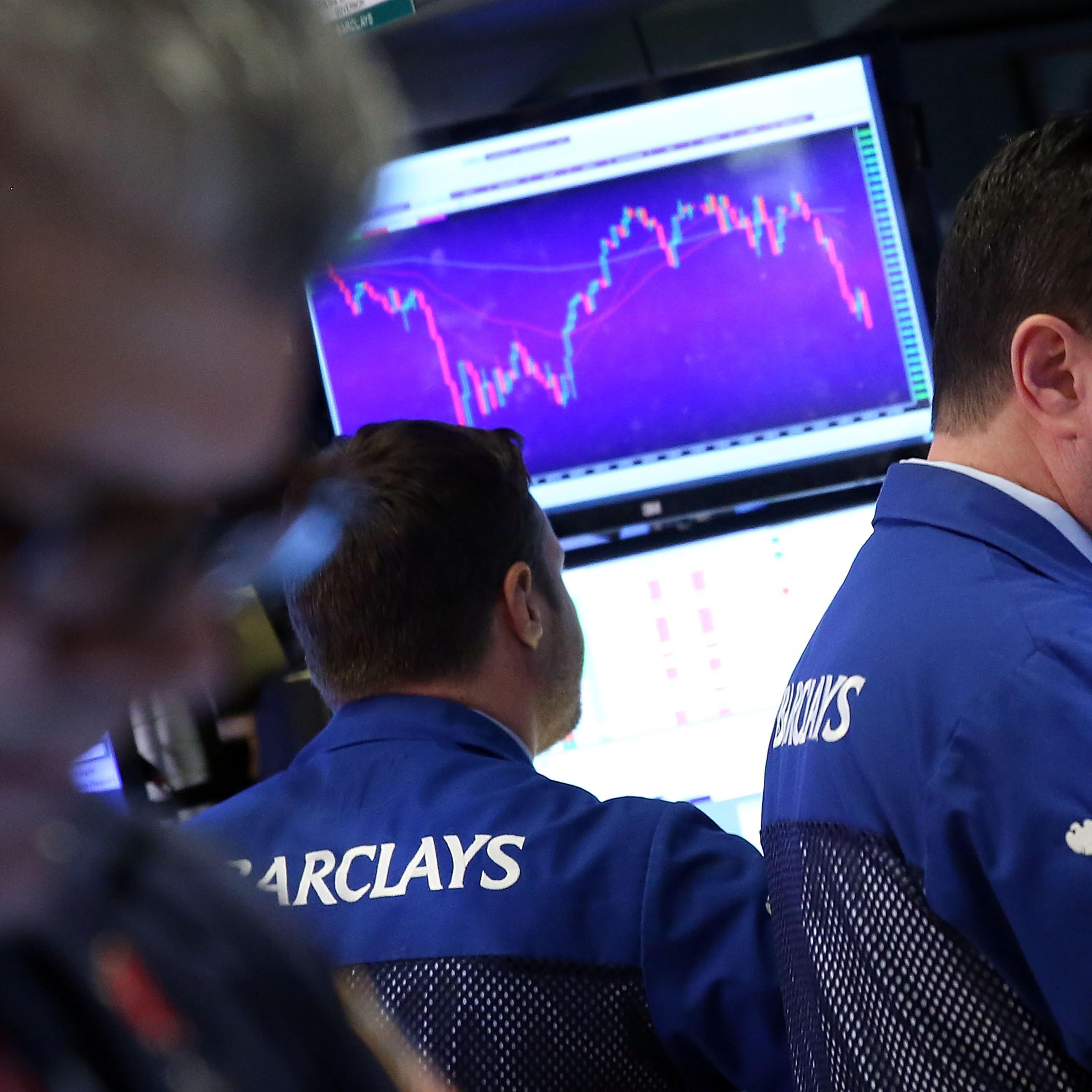 Traders work on the floor of the New York Stock Exchange (NYSE) on January 13, 2016 in New York City.