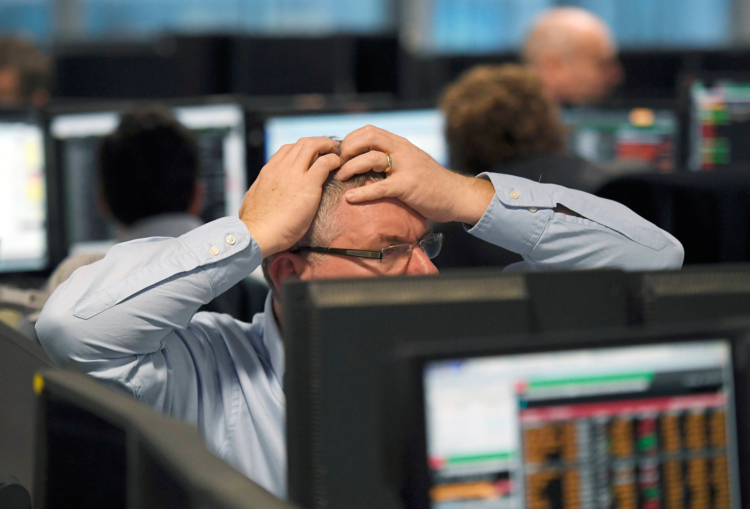 Traders at BGC Partners look at screens after Donald Trump won the U.S. Presidential election, in London, Britain, November 9, 2016. REUTERS/Toby Melville TPX IMAGES OF THE DAY