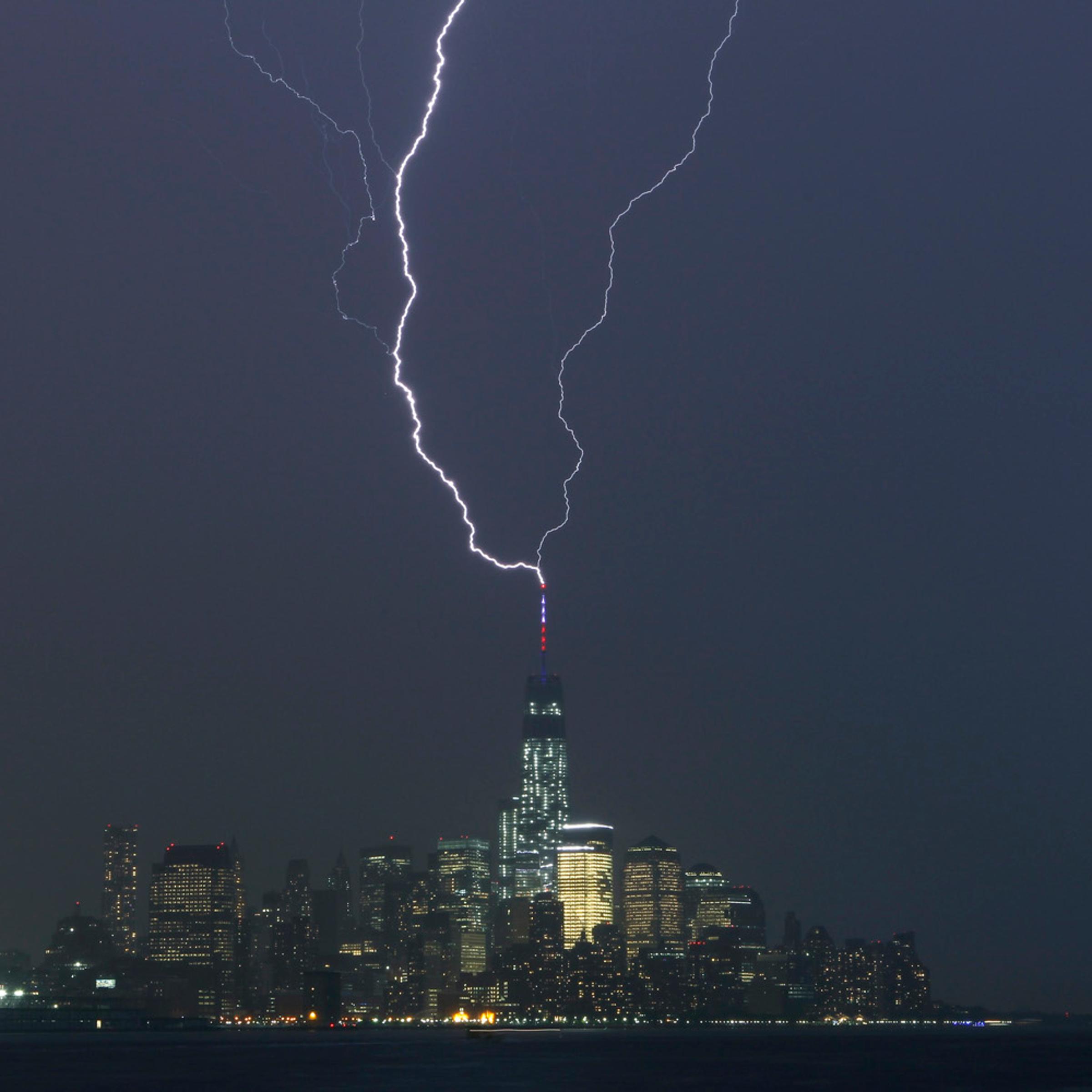 Two bolts of lightning hit the antenna on top of One World Trade Center in Lower Manhattan as an ele