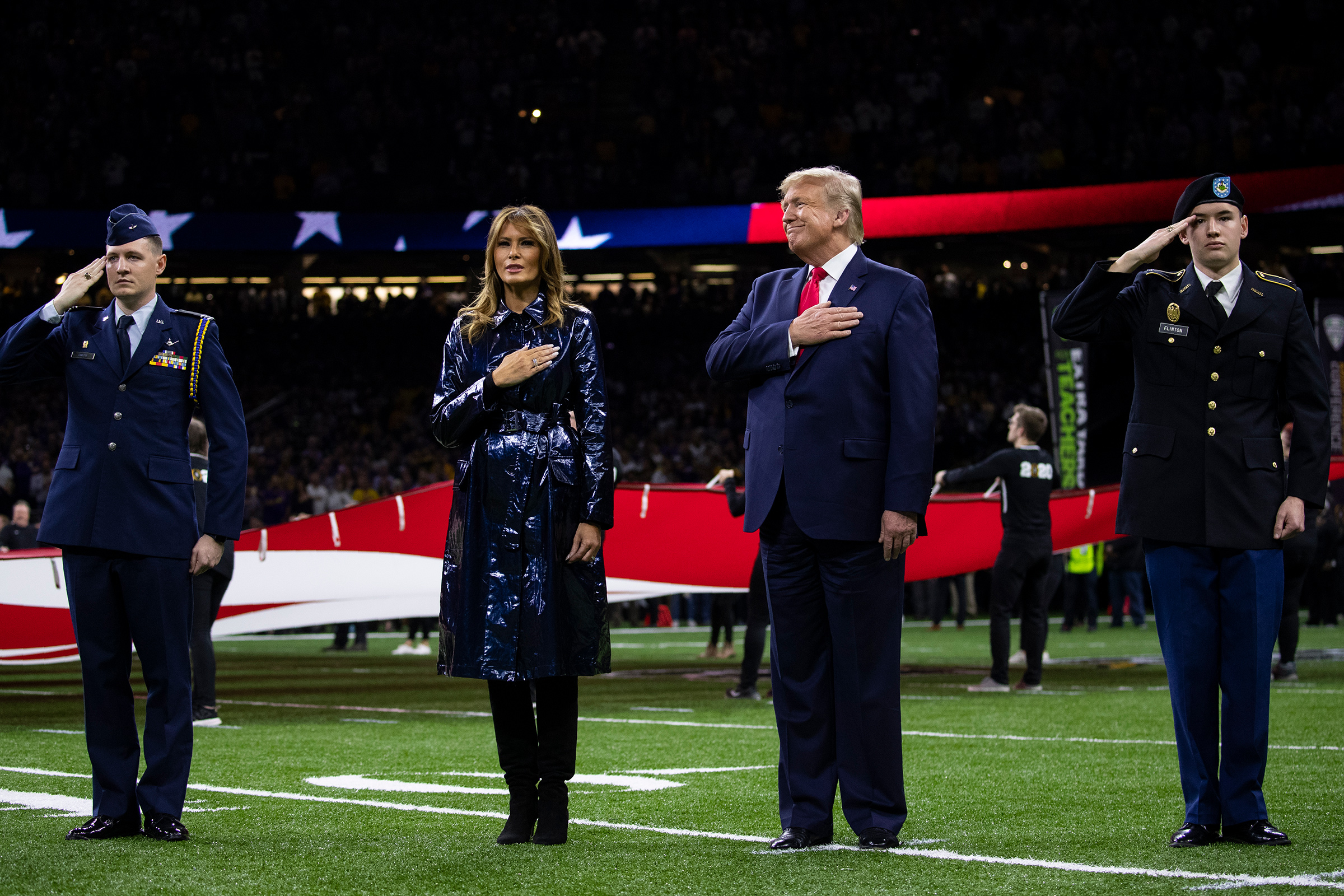 President Donald Trump and first lady Melania Trump stand for the national anthem before the beginning of the College Football Playoff National Championship game on Jan. 13 in New Orleans