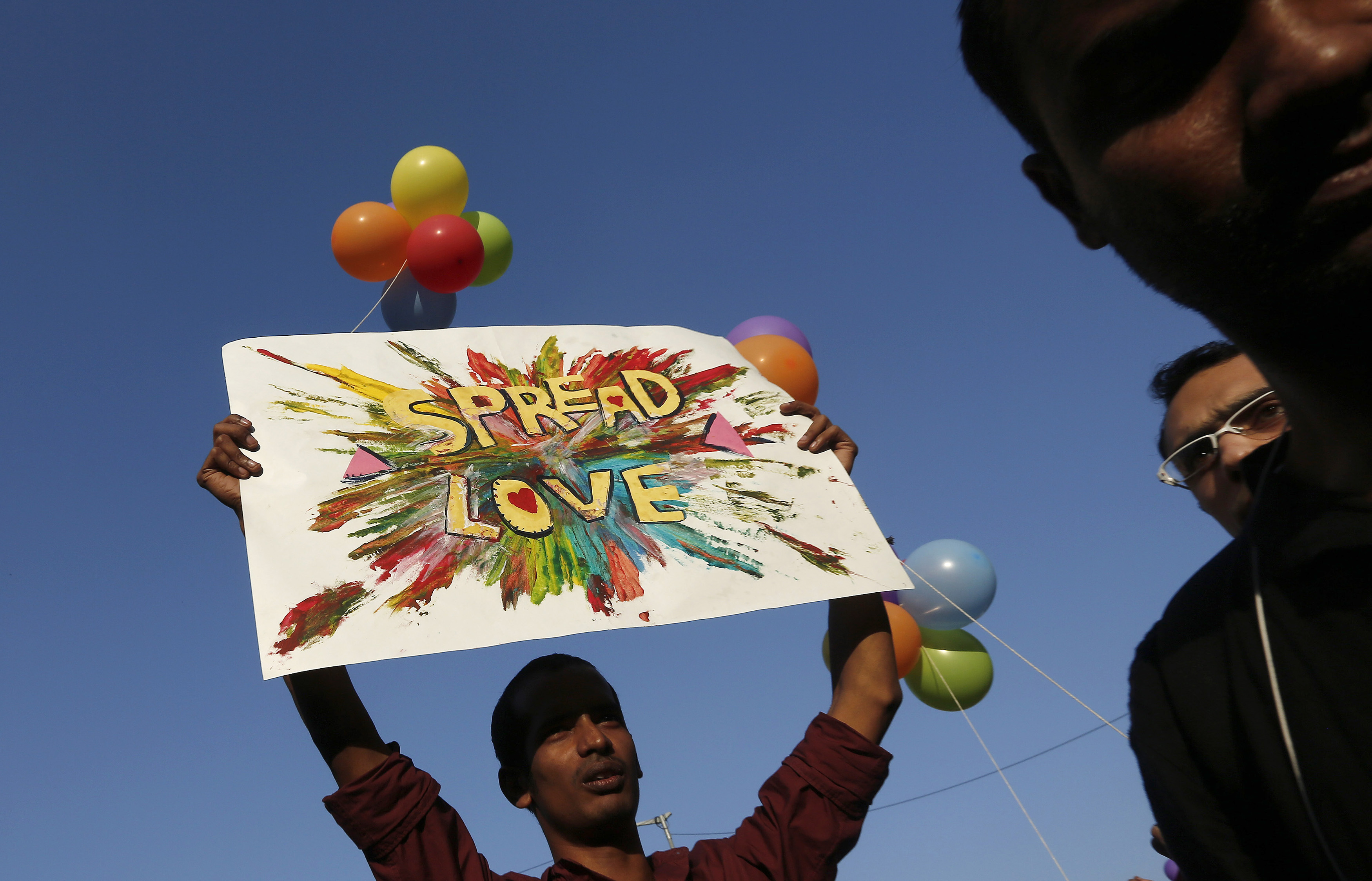 A participant holds a placard during Delhi Queer Pride Parade in New Delhi
