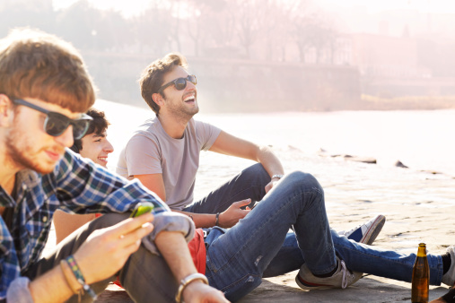 friends-sitting-river