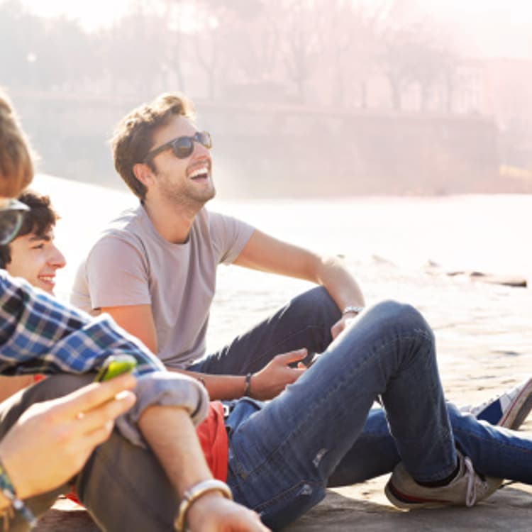 friends-sitting-river