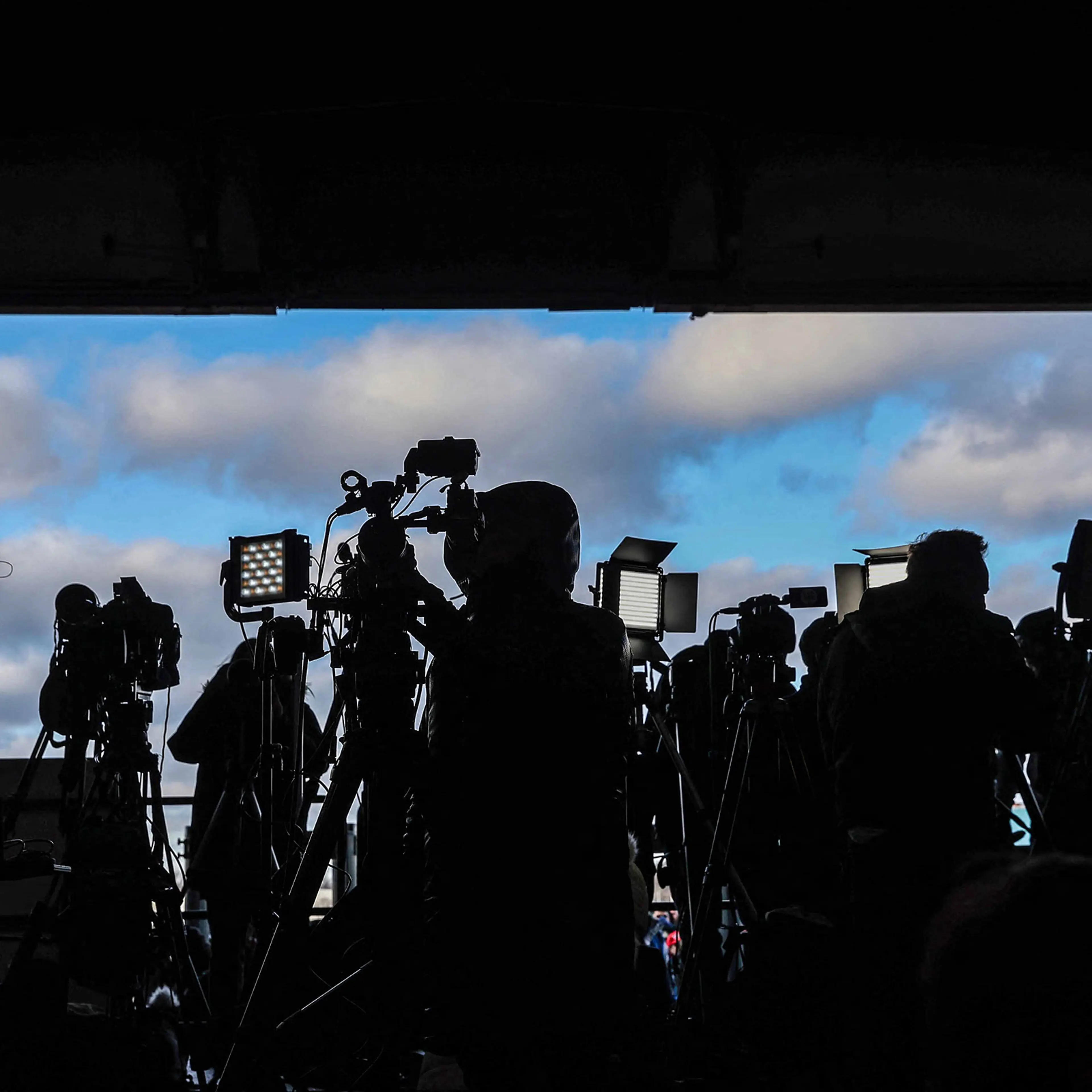 Members of the media wait for the arrival of former President Donald Trump at a "Get Out the Vote" rally in Waterford Township, Michigan, on Feb. 17, 2024.