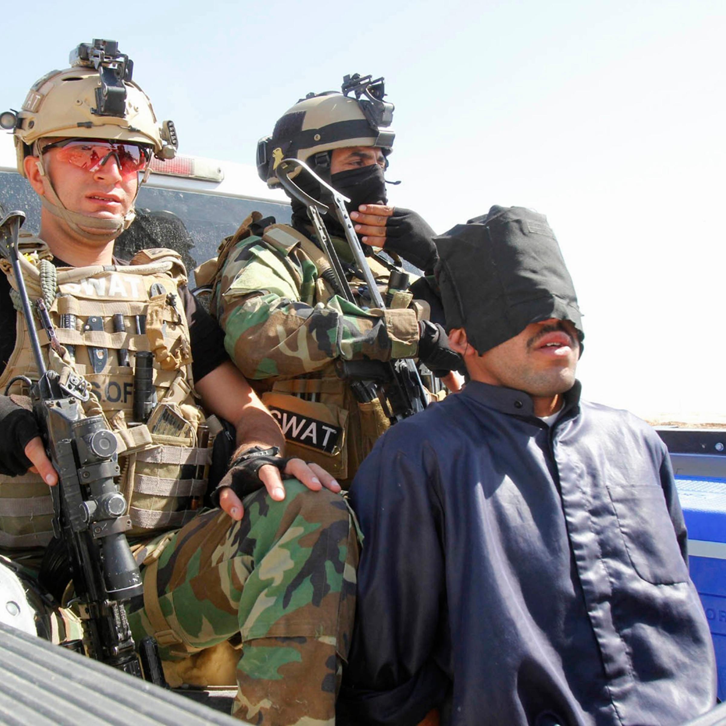 Personnel from the Kurdish security forces detain a man suspected of being a militant belonging to the al Qaeda-linked Islamic State in Iraq and Syria (ISIS) in the outskirts of Kirkuk June 16.