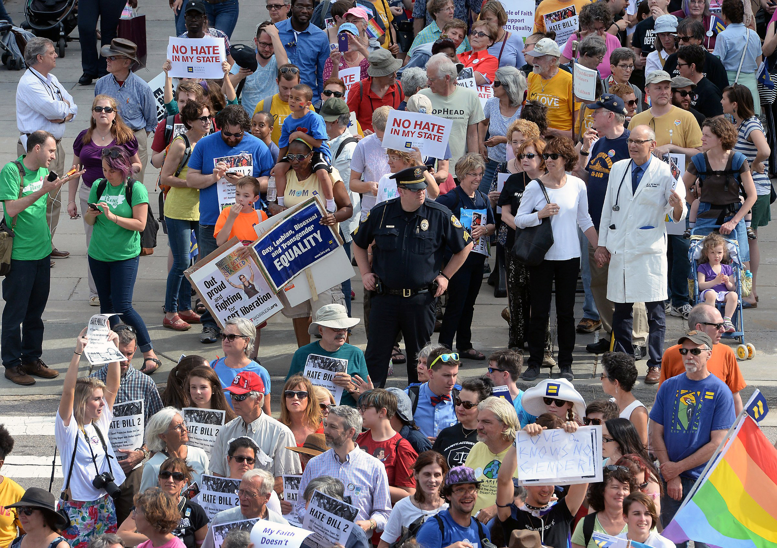 Protesters head into the Legislative building for a sit-in against House Bill 2 in Raleigh, N.C., Monday, April 25, 2016. While demonstrations circled North Carolina's statehouse on Monday, for and against a Republican-backed law curtailing protections f