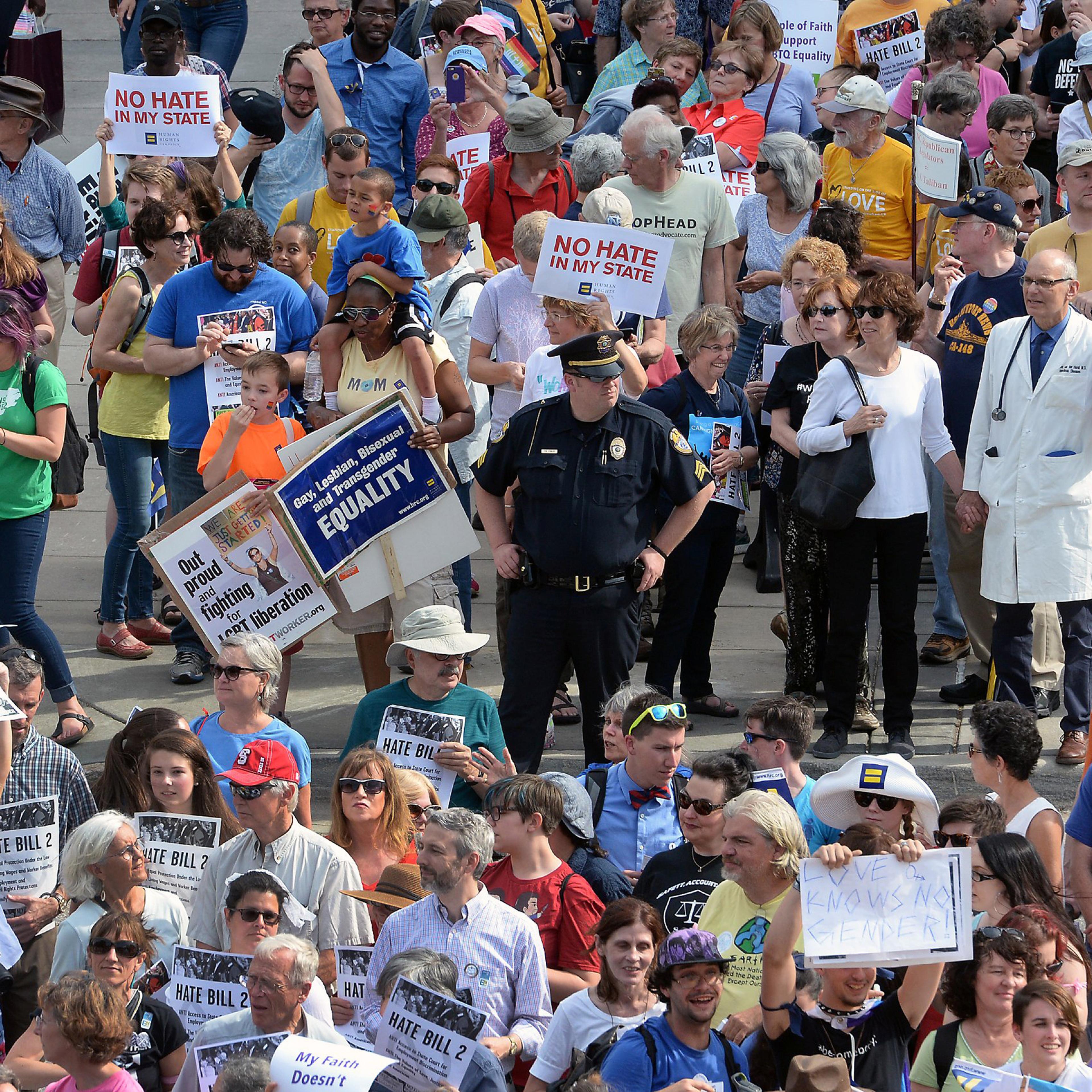 Protesters head into the Legislative building for a sit-in against House Bill 2 in Raleigh, N.C., Monday, April 25, 2016. While demonstrations circled North Carolina's statehouse on Monday, for and against a Republican-backed law curtailing protections f