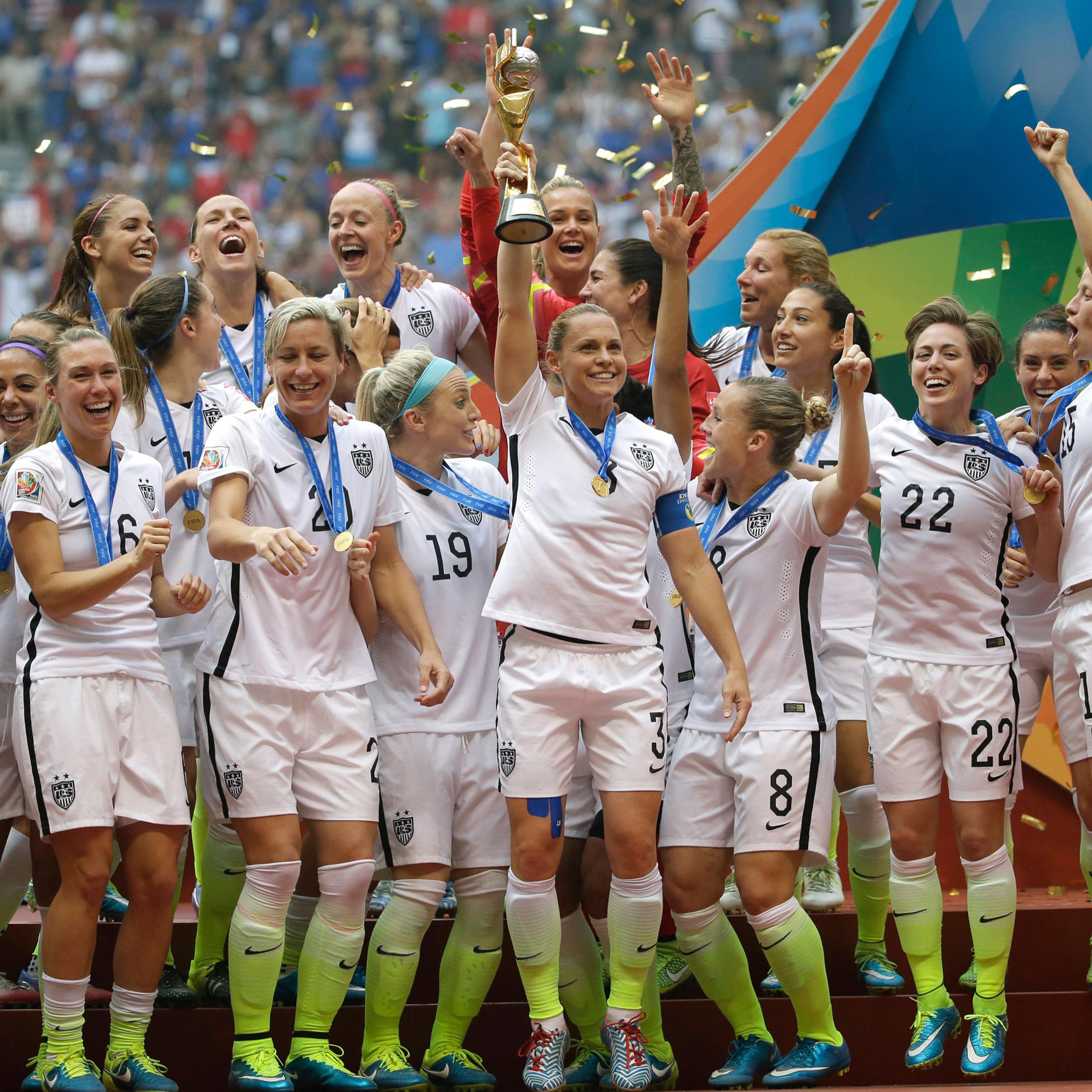 The United States Women's National Team celebrates with the trophy after they beat Japan 5-2 in the FIFA Women's World Cup soccer championship in Vancouver, British Columbia, Canada, Sunday, July 5, 2015. (AP Photo/Elaine Thompson)