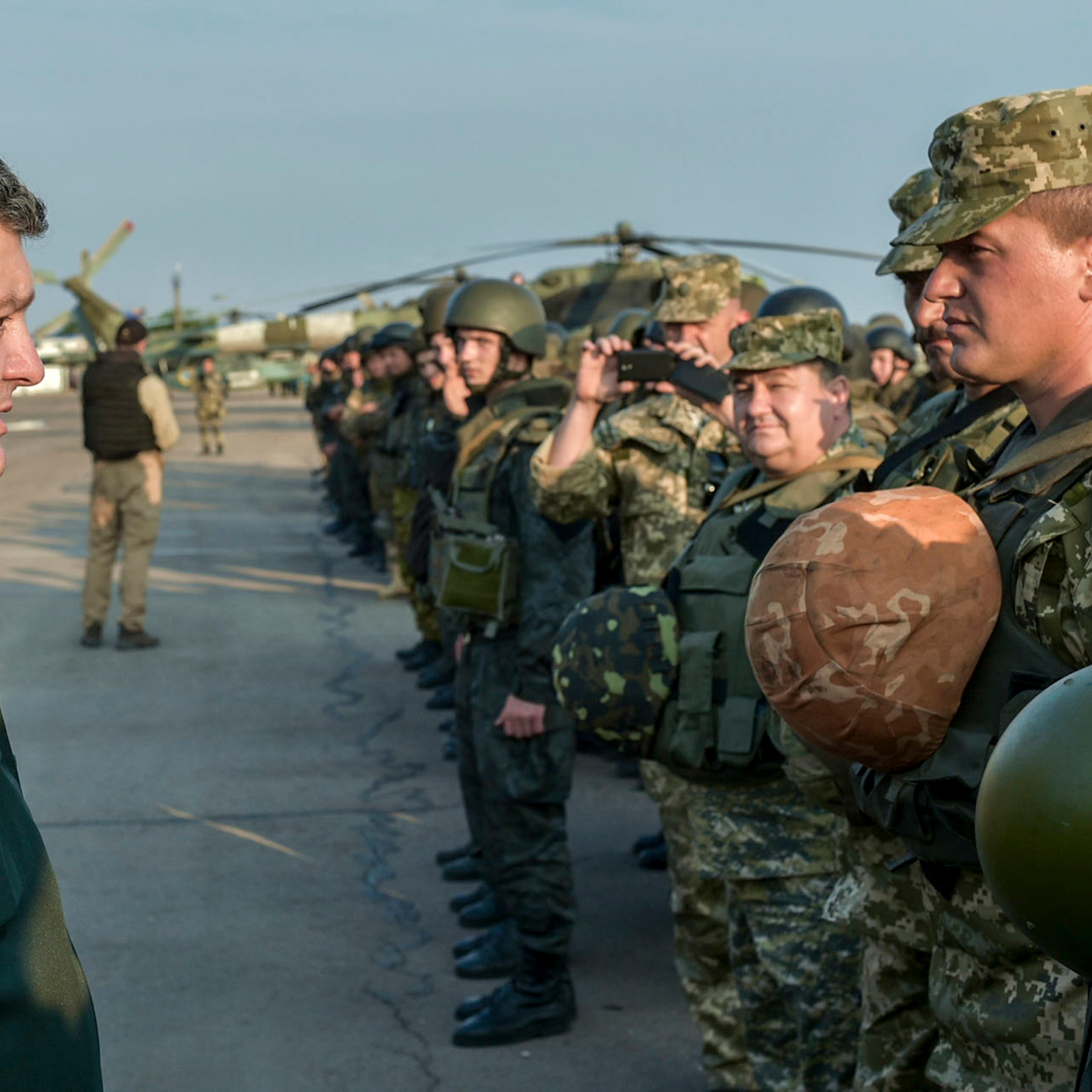 Ukrainian President Poroshenko meets with Ukrainian servicemen during his visit to the coastal town of Mariupol