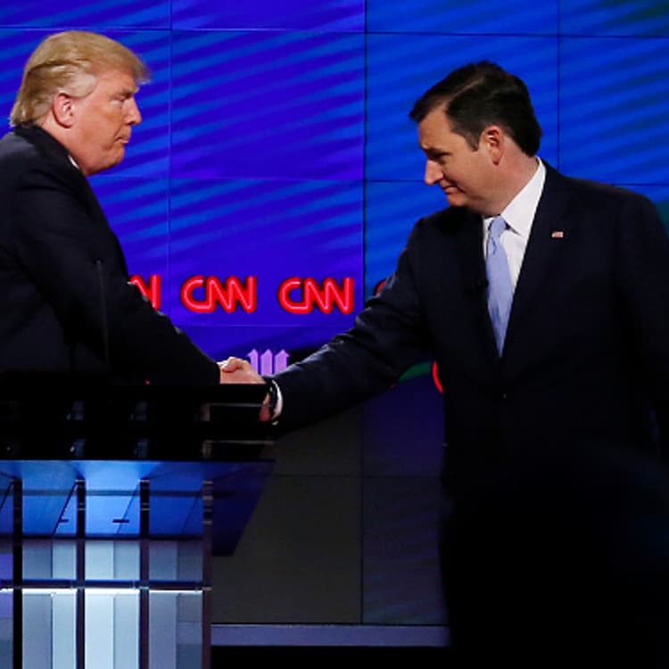 Donald Trump (L) shakes hands with Texas Senator Ted Cruz (R) following the CNN Republican Presidential Debate March 10, 2016 in Miami, Florida.