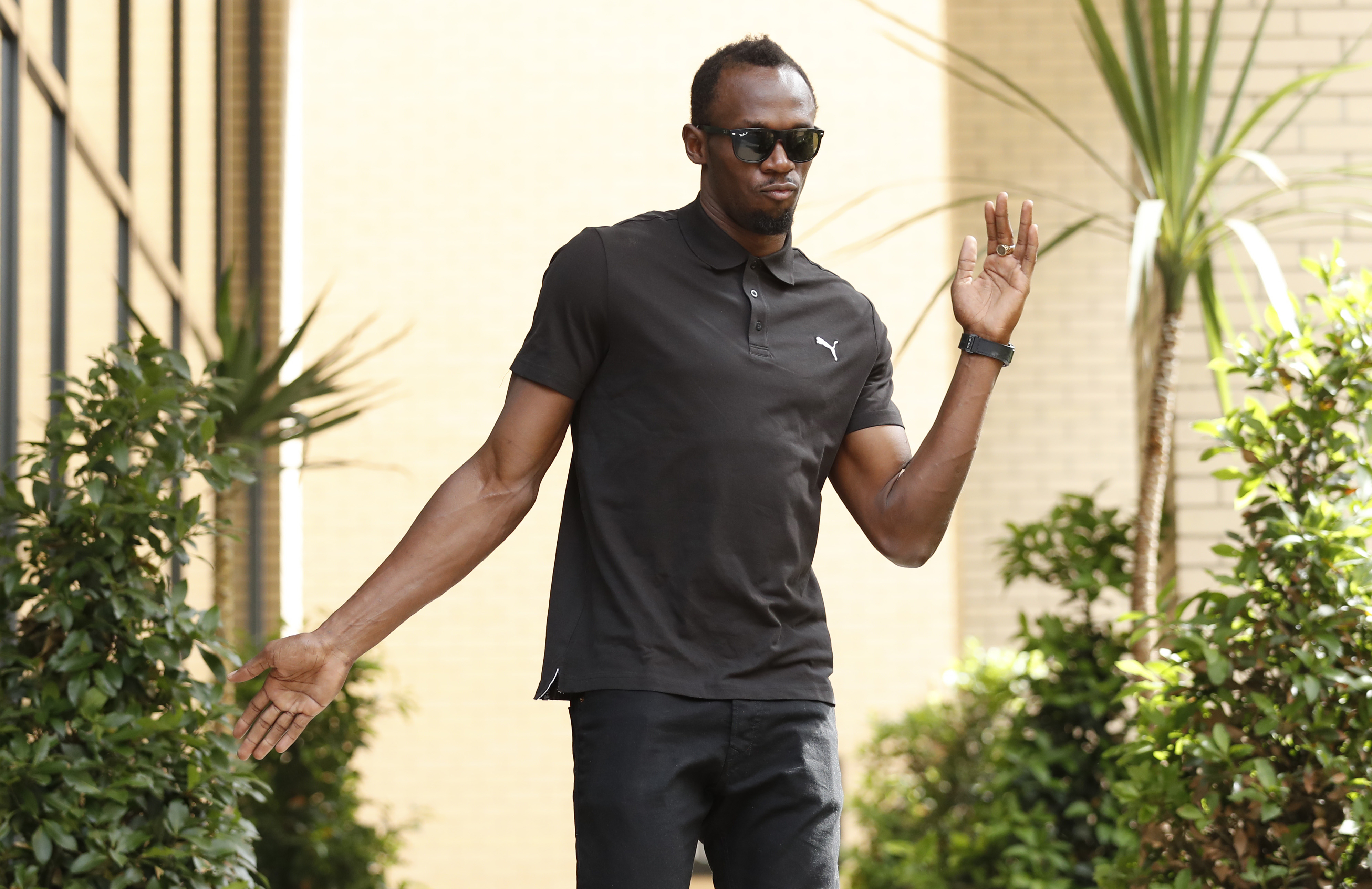Jamaica's Usain Bolt poses before a press conference in London, July 21, 2016.