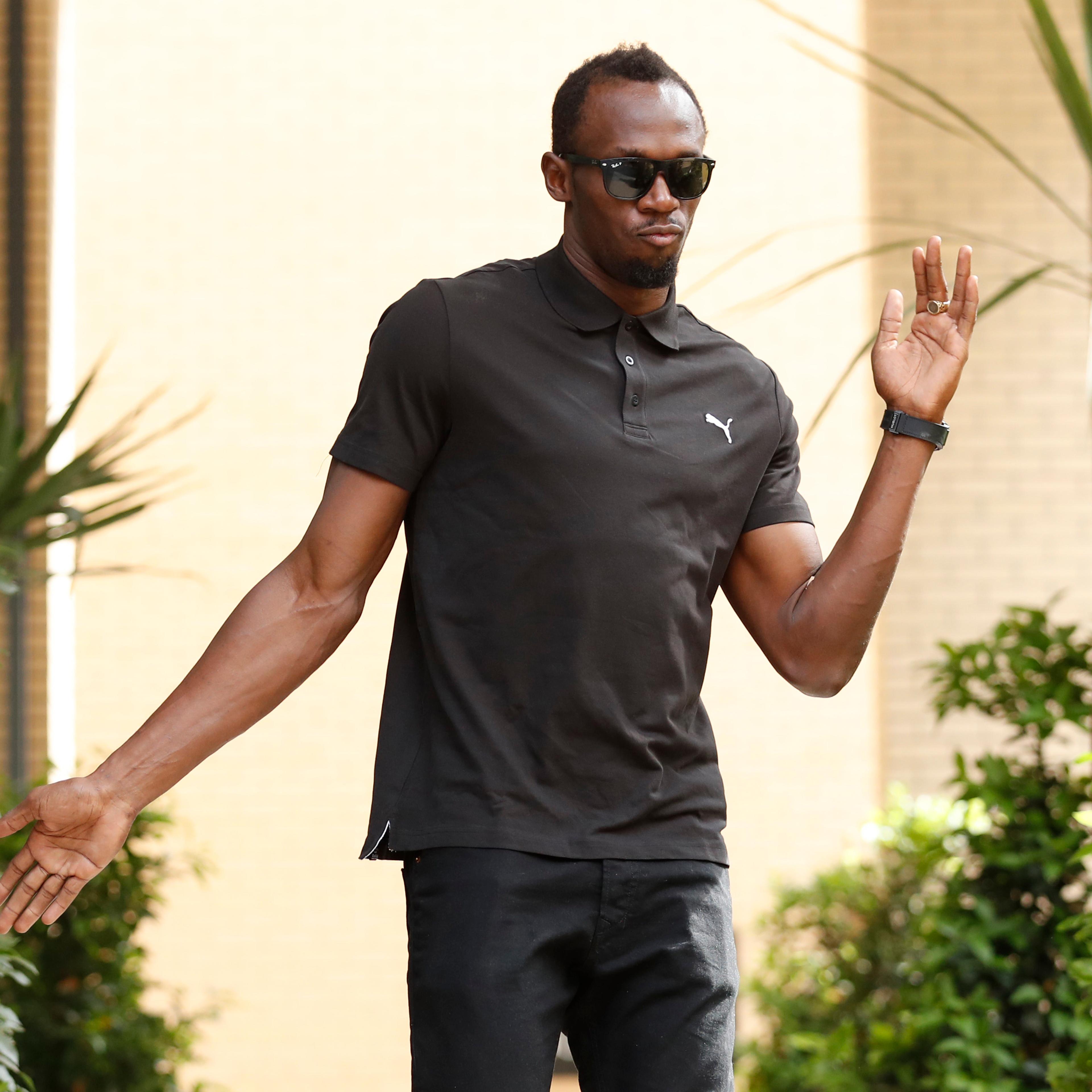Jamaica's Usain Bolt poses before a press conference in London, July 21, 2016.