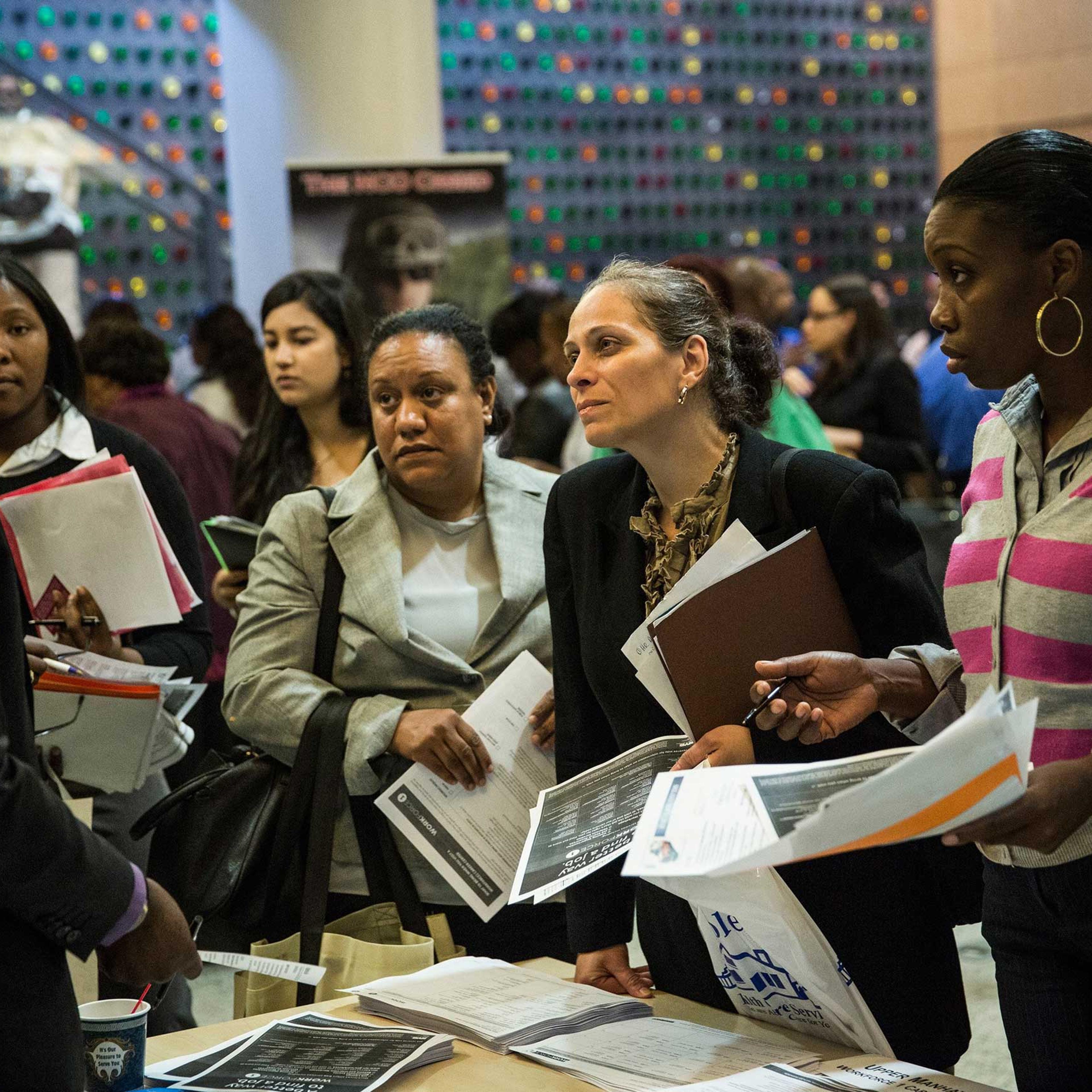 People attend a jobs fair at the Bronx Public Library on Sept. 17, 2014 in the Bronx Borough of New York City.