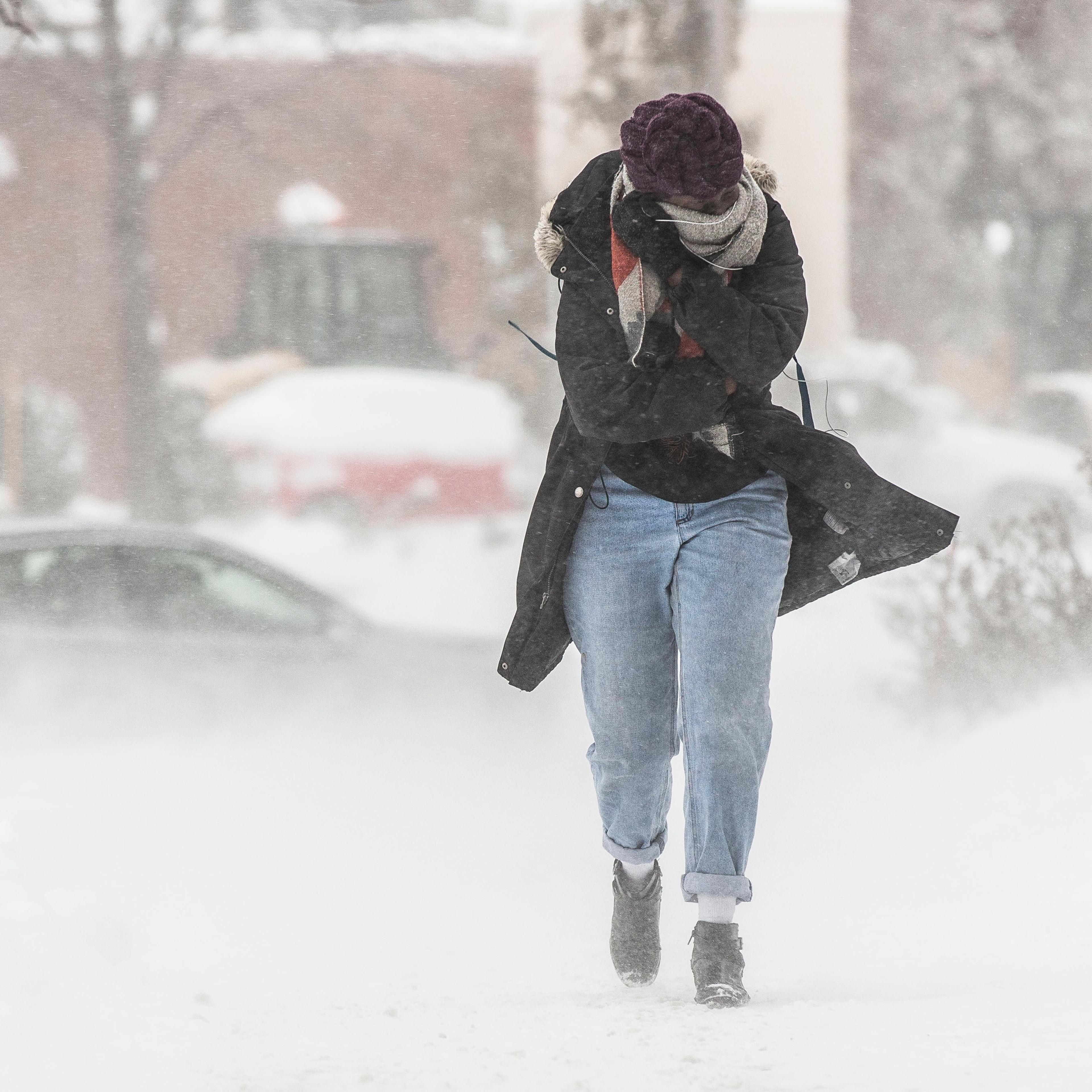Full Length Of Woman Walking On Road During Winter