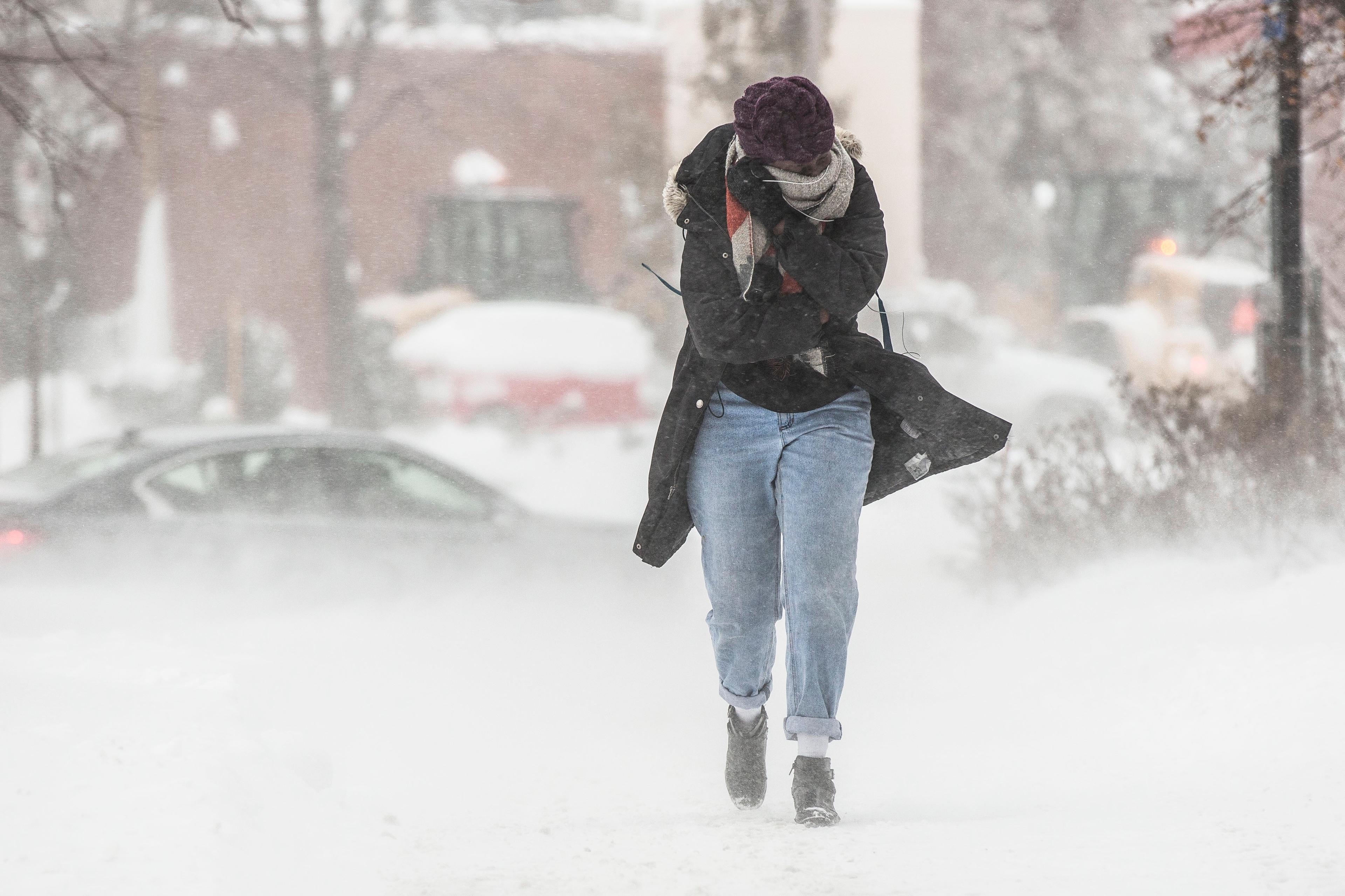 Full Length Of Woman Walking On Road During Winter