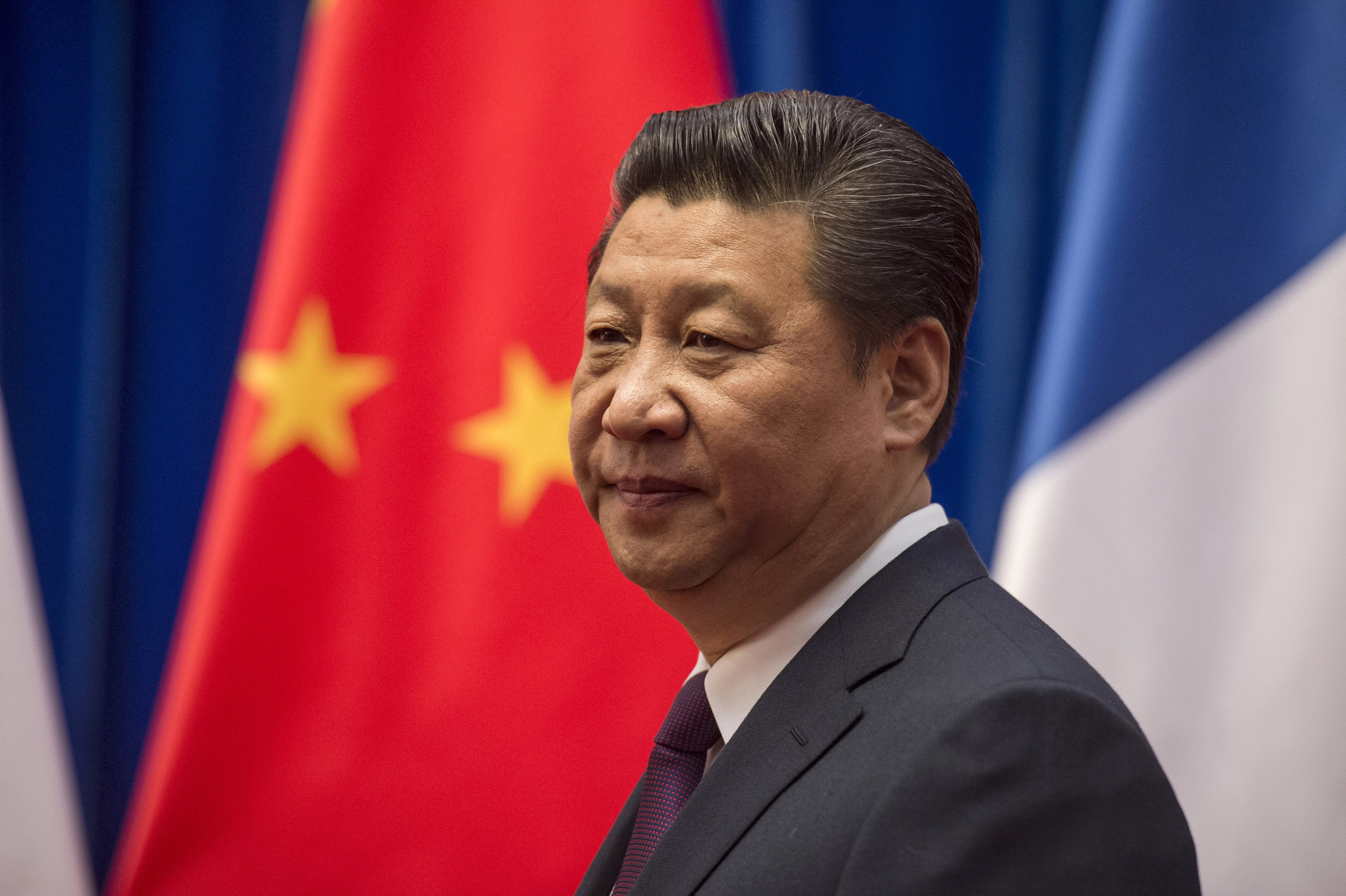 Chinese President Xi Jinping waits to welcome French Prime Minister Manuel Valls at the Great Hall of the People in Beijing January 30, 2015.