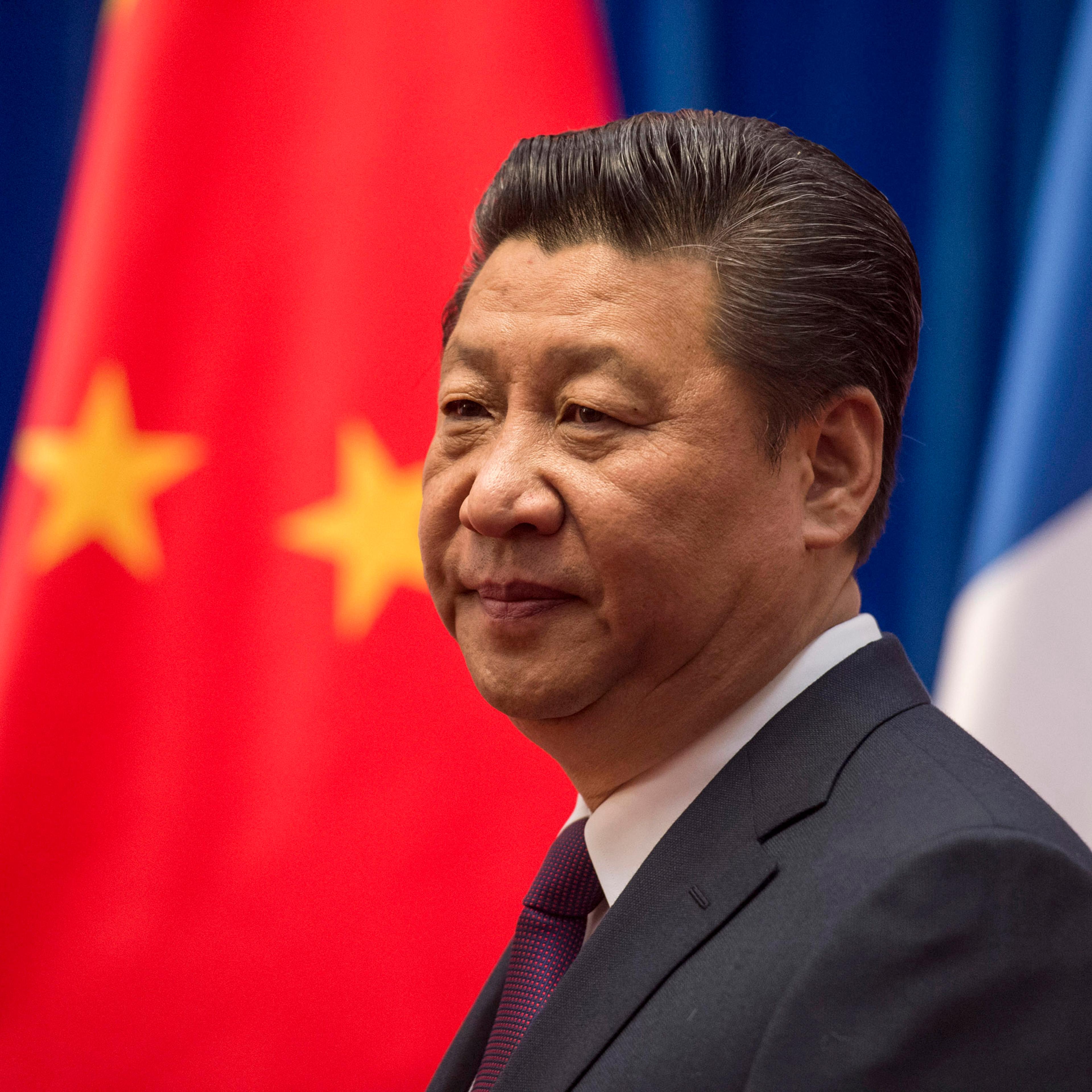 Chinese President Xi Jinping waits to welcome French Prime Minister Manuel Valls at the Great Hall of the People in Beijing January 30, 2015.