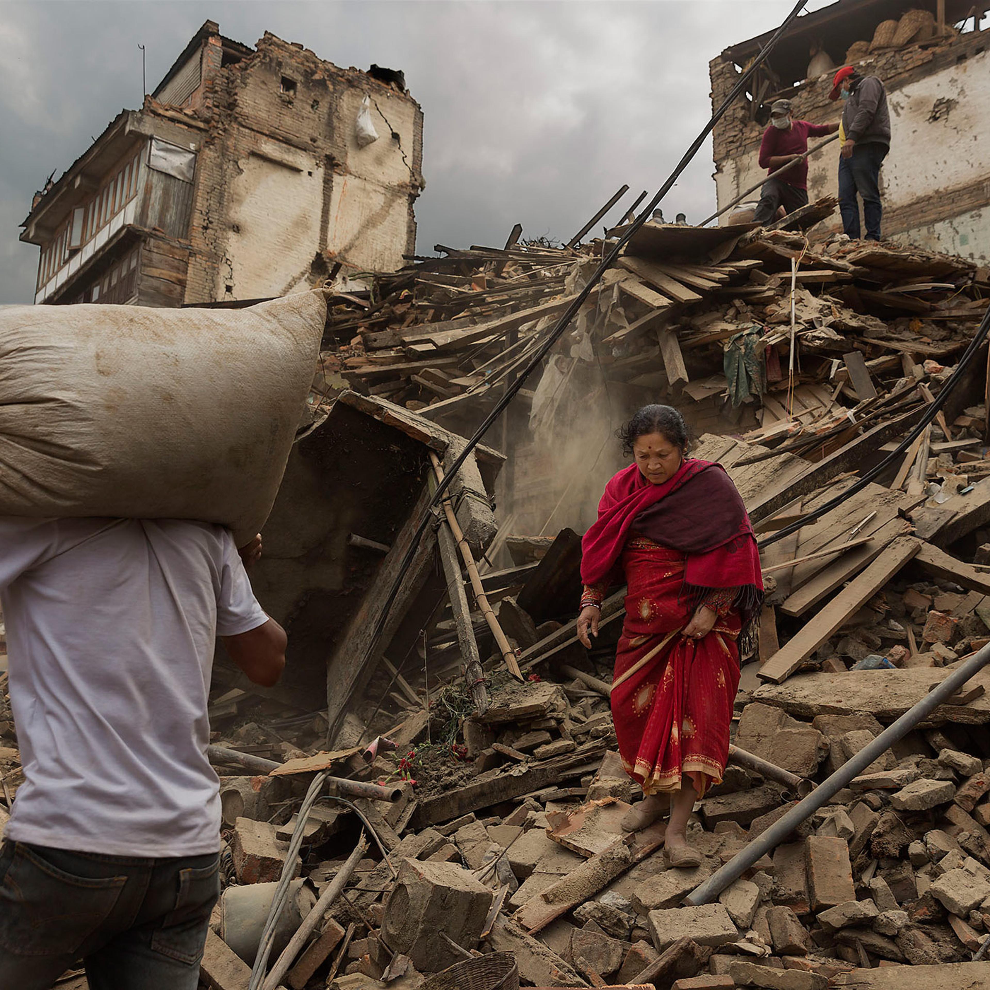 Nepal earthquake. Bhaktapur. A city near Katmandu. People reclaiming their possessions from the wreckage. A man who had been buried and died being pulled out of the wreckage by there Nepali Army rescue team. Sculpture of elephant in ruins of an ancient,