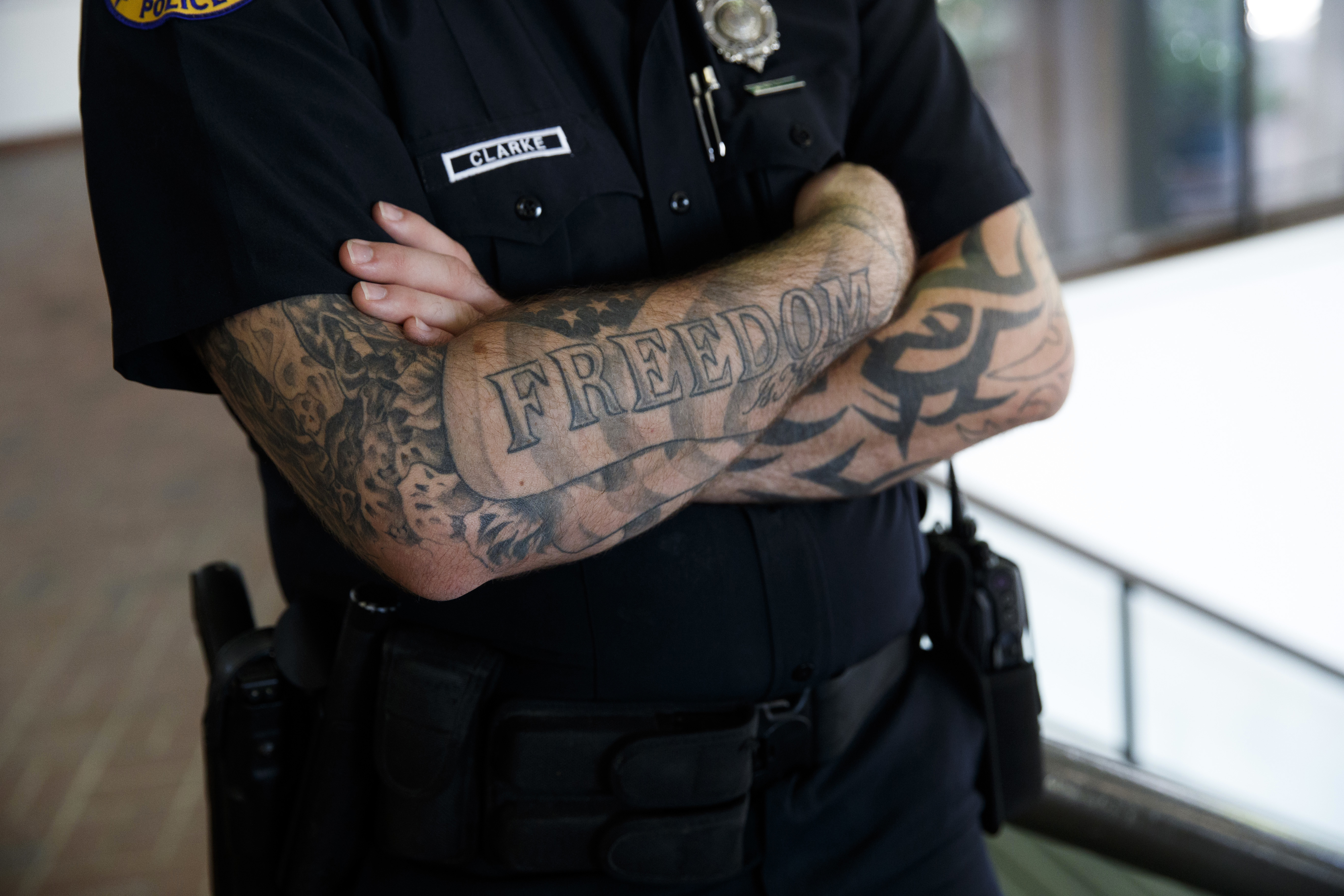A Miami police officer stands guard during a campaign event with Republican presidential candidate Donald Trump at the James L. Knight Center, Sept. 16, 2016, in Miami.