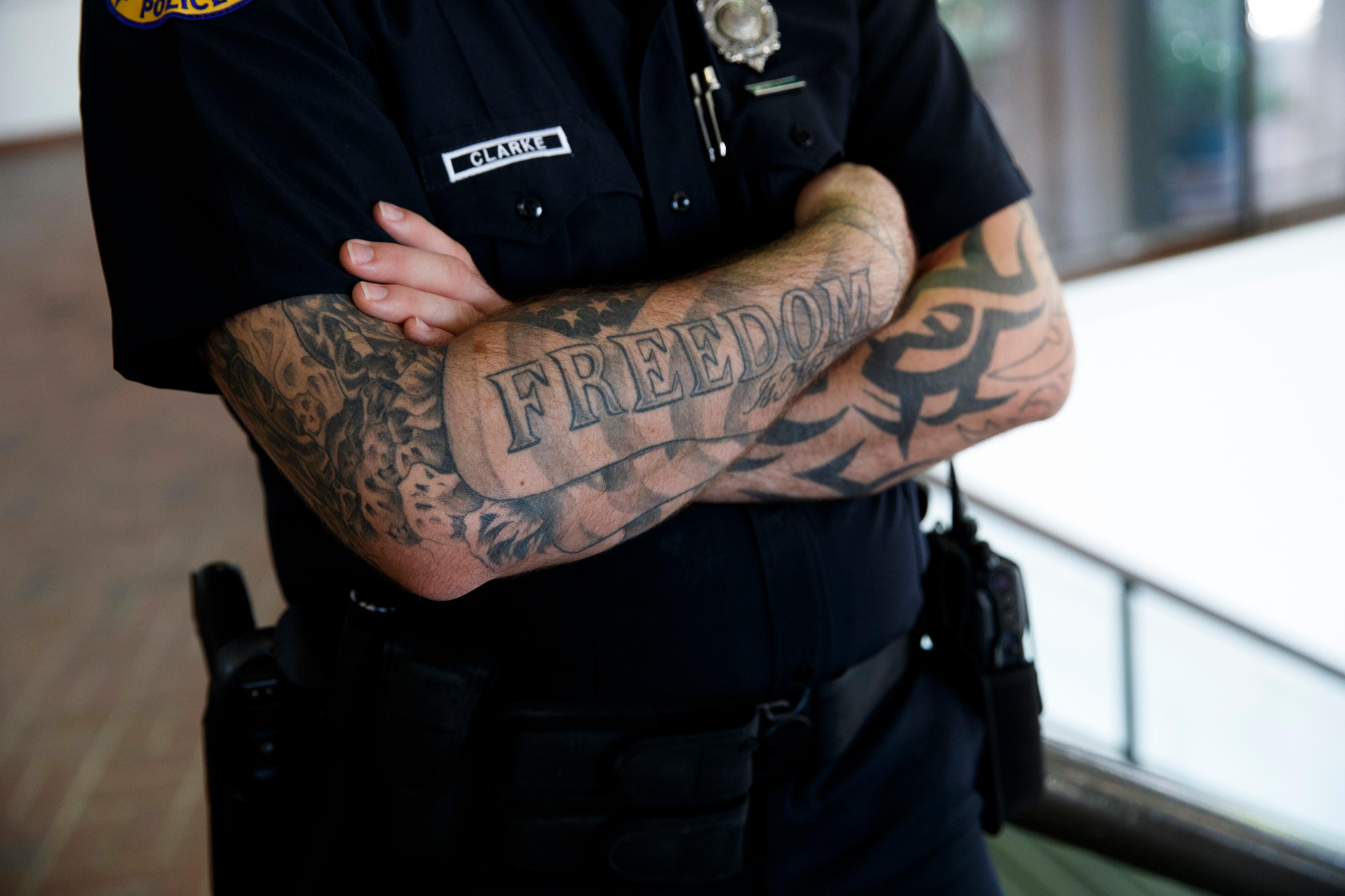 A Miami police officer stands guard during a campaign event with Republican presidential candidate Donald Trump at the James L. Knight Center, Sept. 16, 2016, in Miami.