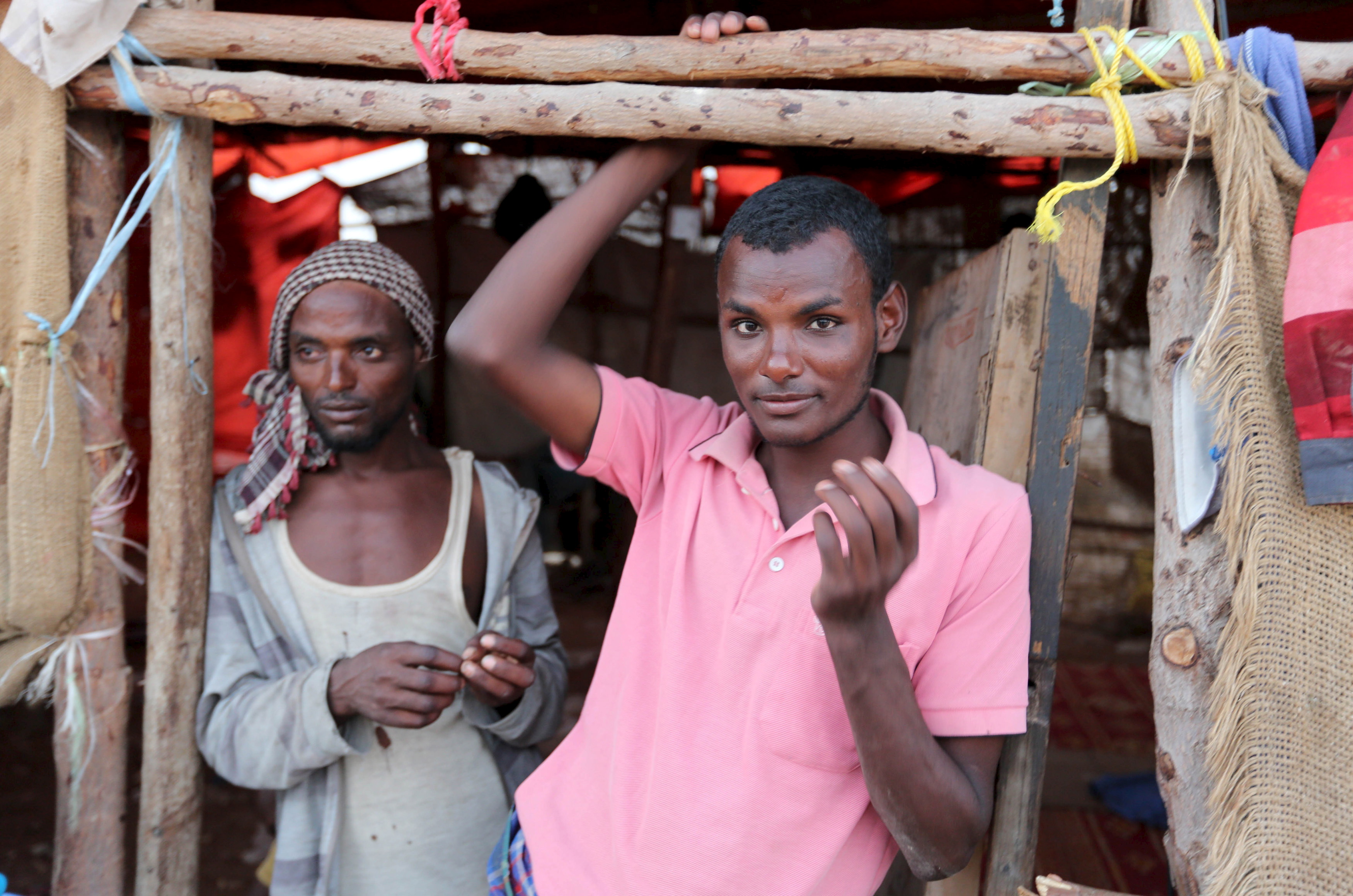 Illegal immigrants from Ethiopia attempting to cross into Yemen stand at their makeshift shelter in Bosasso, northern Somalia's breakaway Puntland region