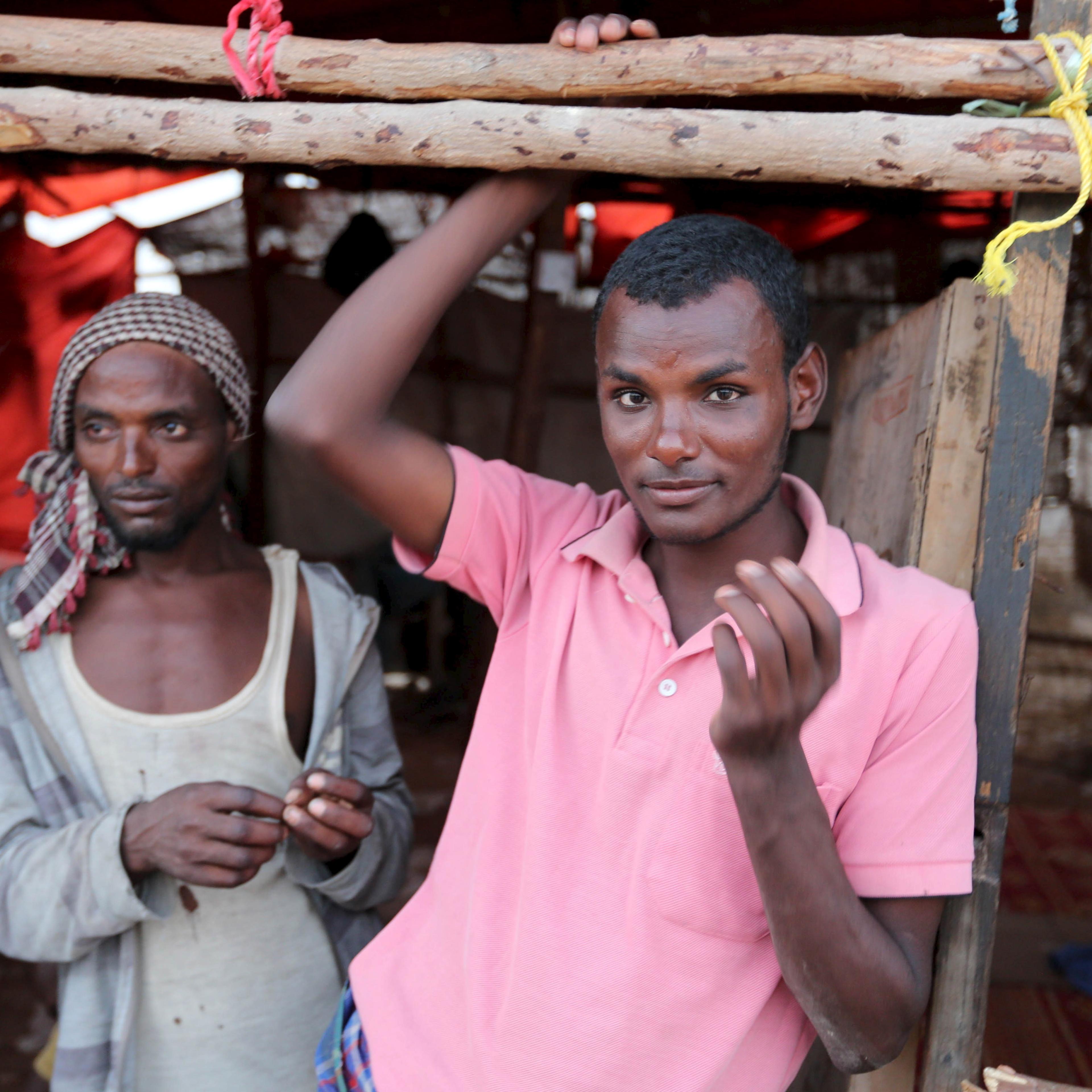 Illegal immigrants from Ethiopia attempting to cross into Yemen stand at their makeshift shelter in Bosasso, northern Somalia's breakaway Puntland region