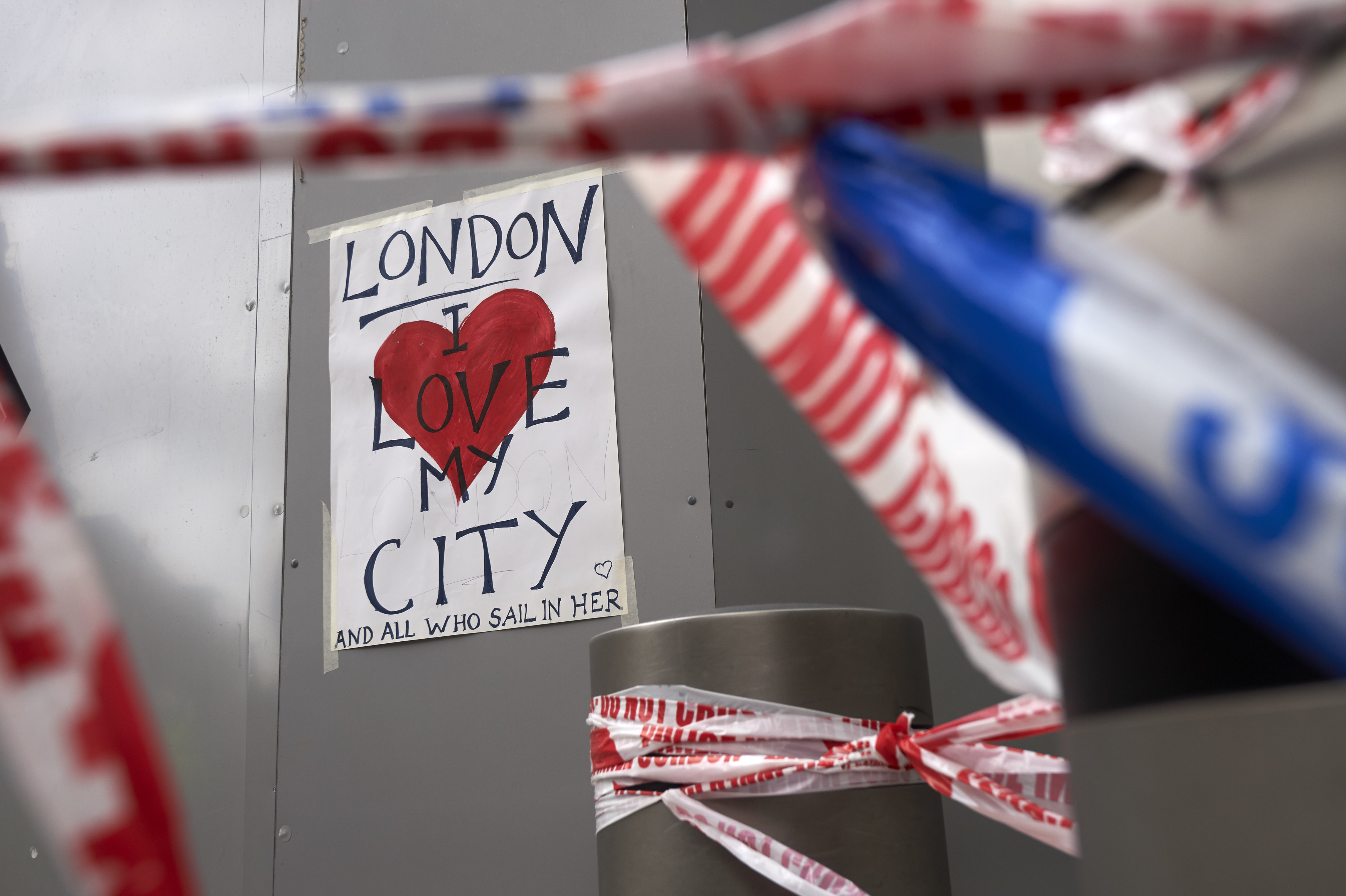 A poster in solidarity is seen on a hoarding outside London Bridge railway station in London on June 5, 2017 at the cordon near the police scene of the June 3 terror attack on London Bridge and the nearby Borough Market.